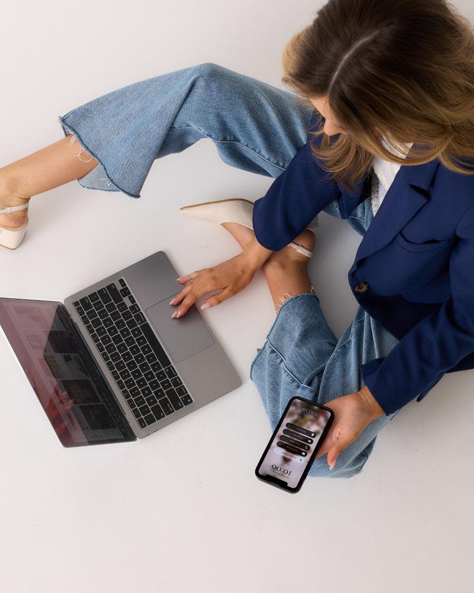 Overhead shot of a model in straight leg, medium wash jeans and a navy blazer.