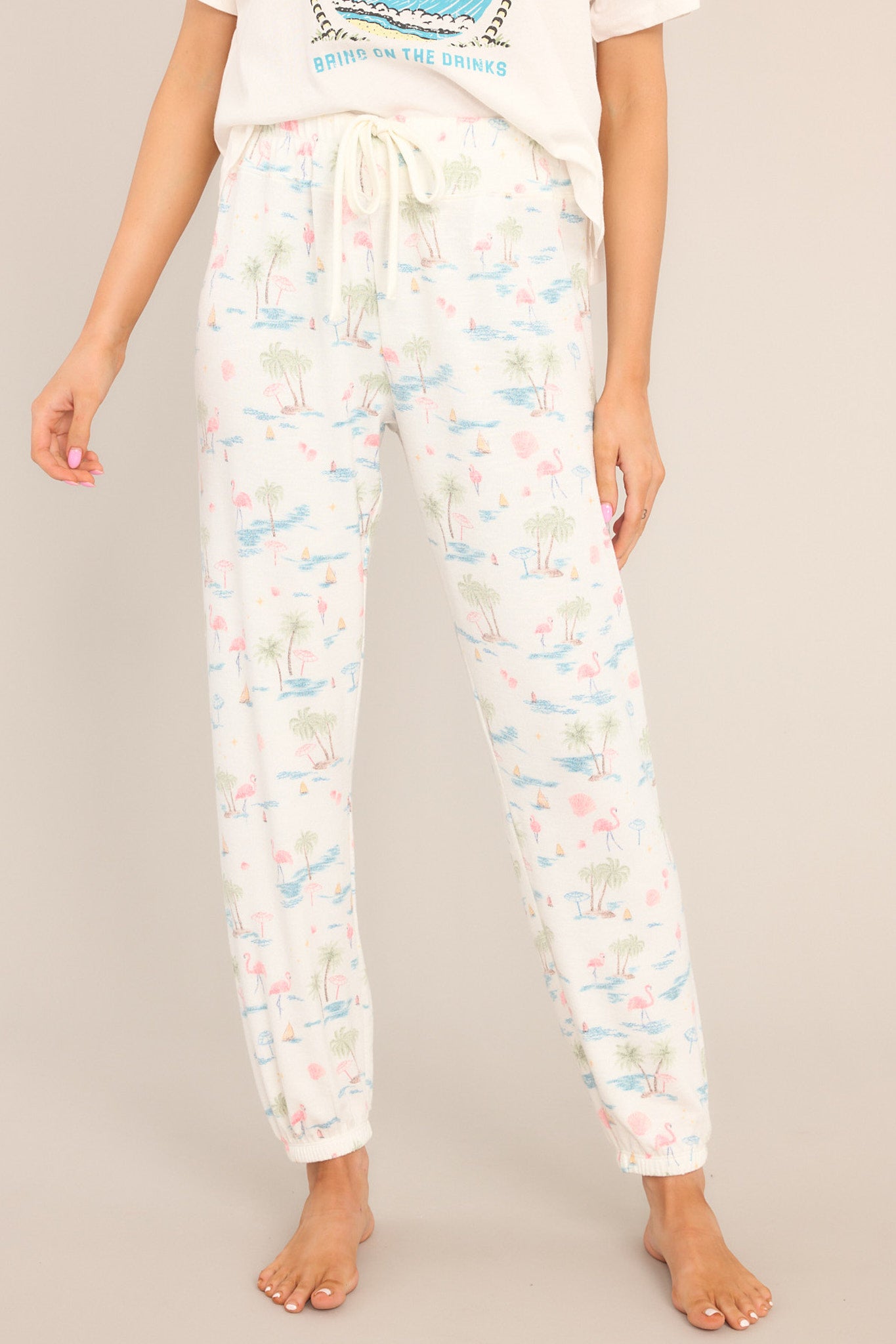 Front view of these joggers that feature an elastic waistband, a self-tie drawstring, a soft & breathable material, and elastic cuffed ankles.