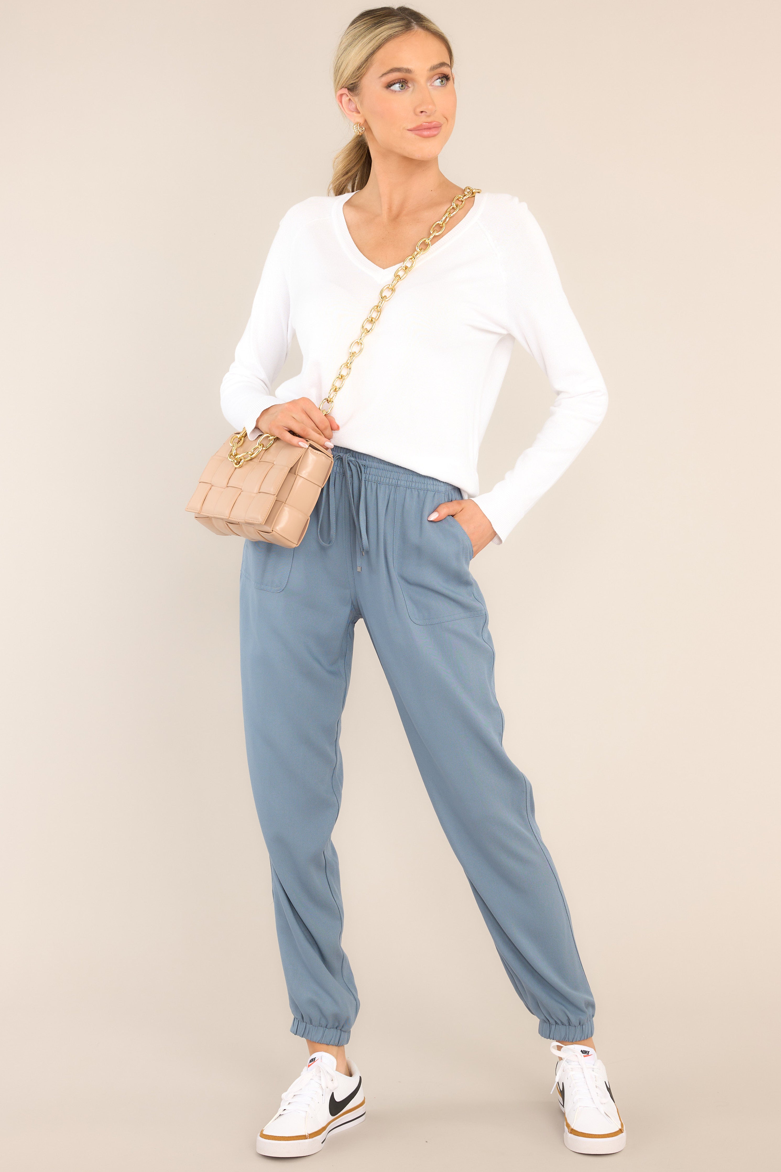 These chambray joggers feature an elastic waist with a self-tie drawstring, two functional waist pockets, an elastic ankle, and a lightweight breathable fabric.