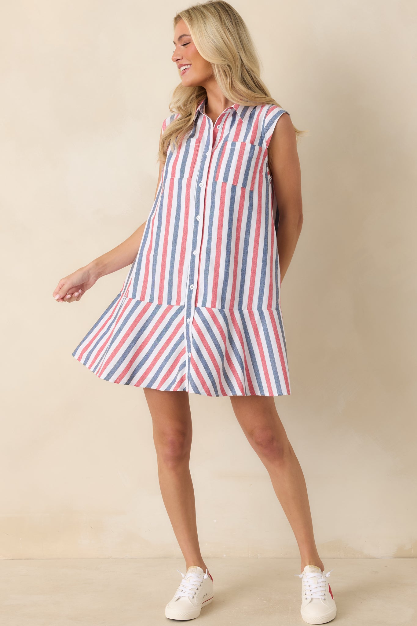 Striped shirt dress with a collared neckline, functional button closure, and easy-flowing shape.