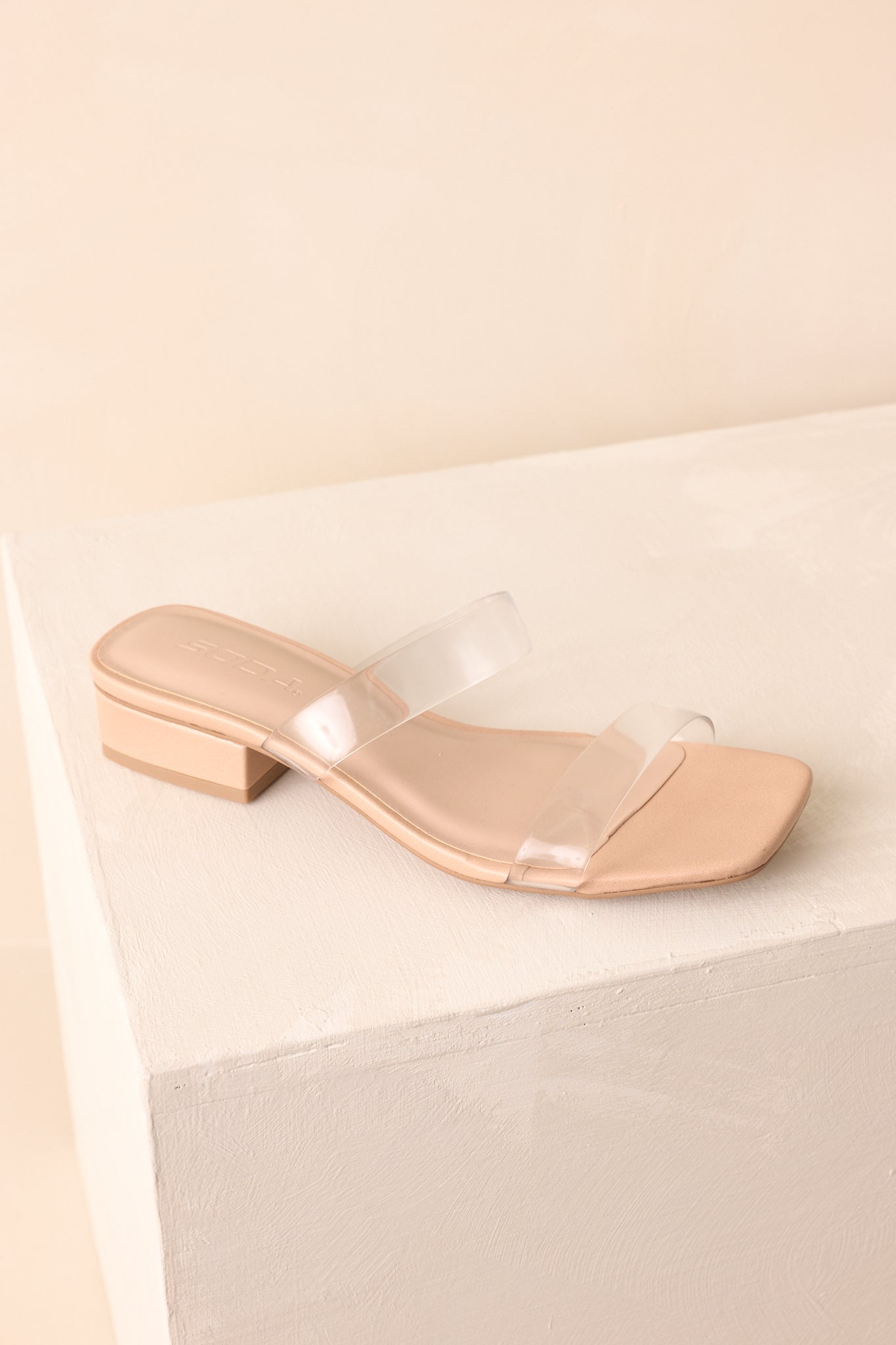 Top-down angled view of open-toe slide sandals showing square toe and strap design.