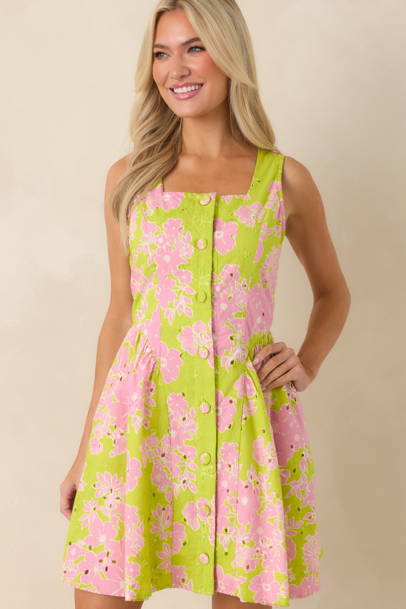 Cropped detail of fitted bodice with soft flare and subtle eyelet accents.
