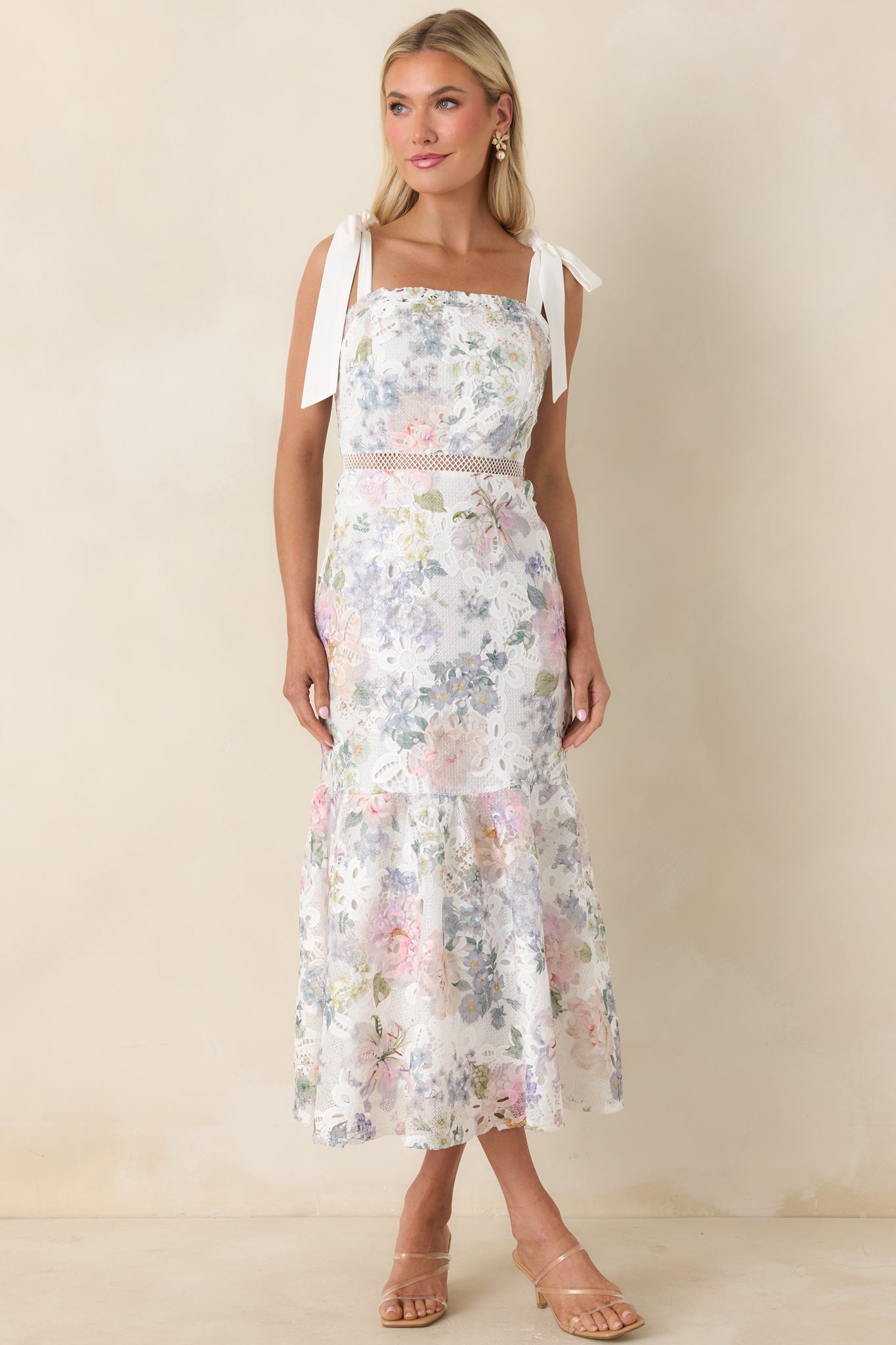 Front view of a midi dress showing delicate lace overlay and fitted bodice with square neckline.