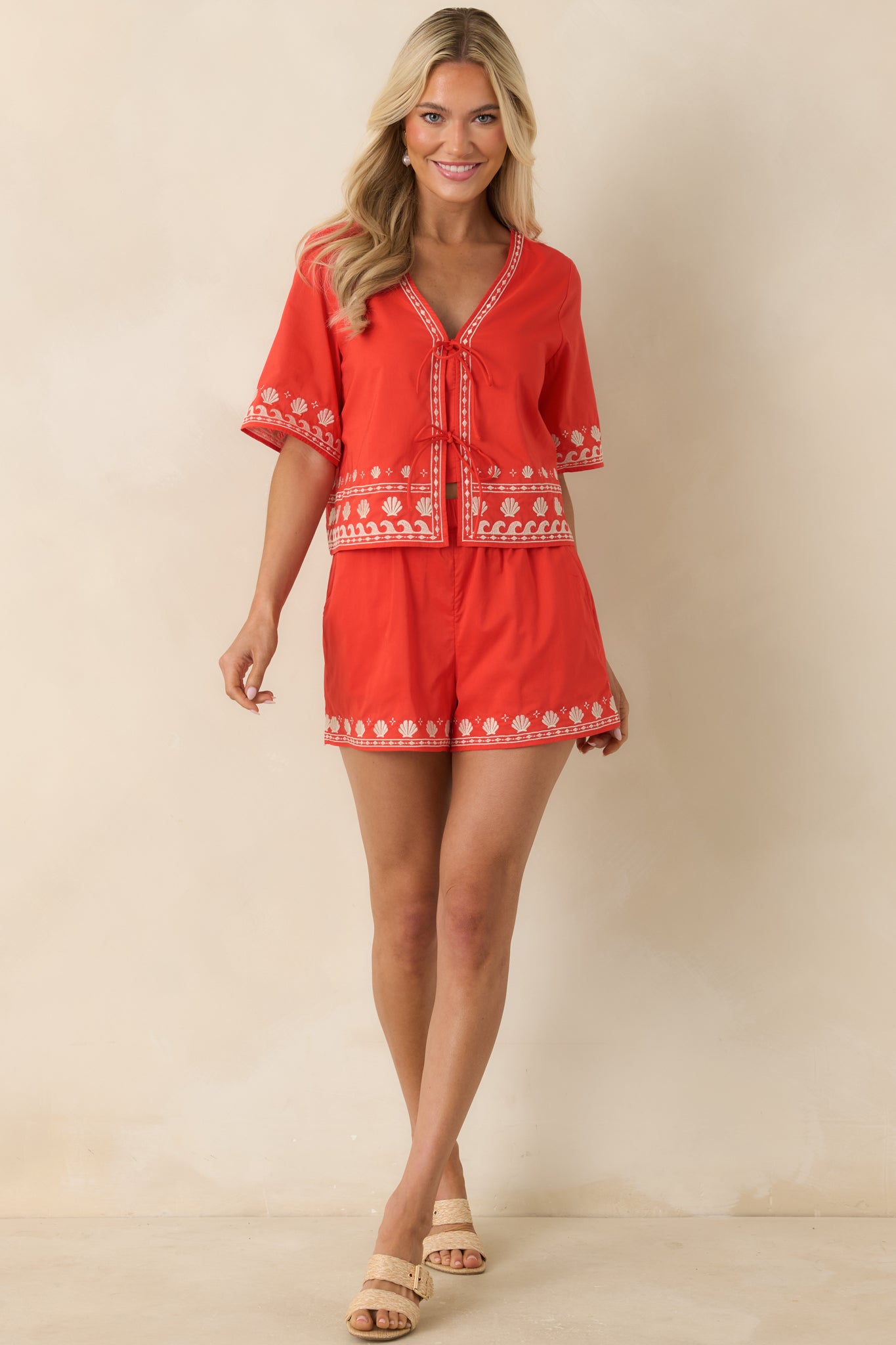 Cotton cropped top featuring a v-neckline, decorative shell and wave stitching, and a relaxed warm-weather design.