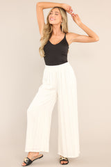 These white pants feature an elastic waistband and a flowy wide leg. 