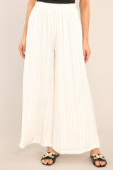 Front view of these pants that feature an elastic waistband and a flowy wide leg.