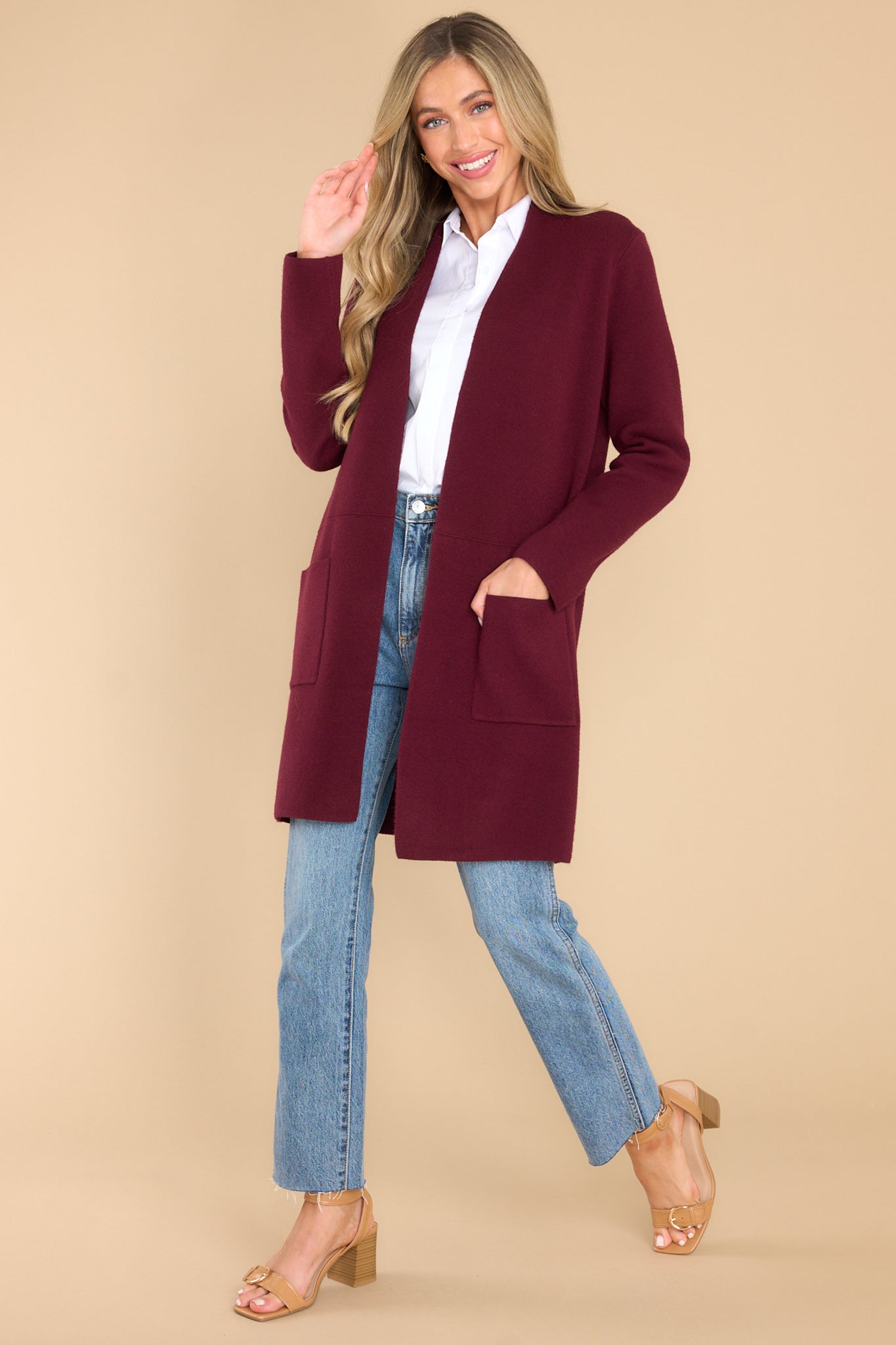 Full body view of this cardigan that features an open front design, two functional pockets and long sleeves.