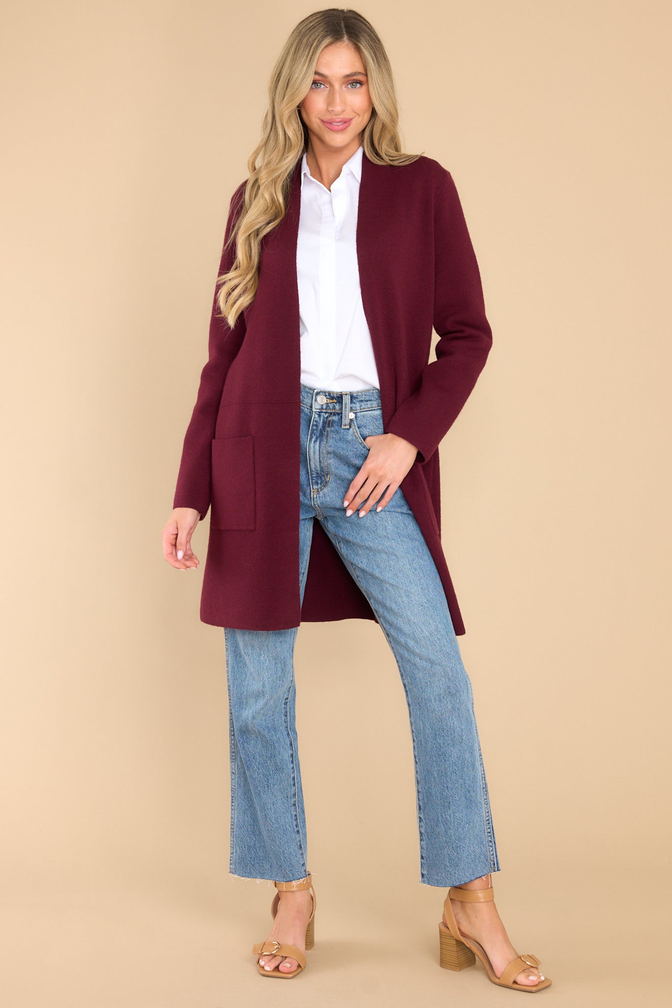 Full body view of this cardigan that features an open front design, two functional pockets, long sleeves, and a soft knit feel throughout.