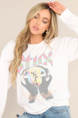 Full front view of this sweatshirt that features a crew neckline, the Styx's sixth studio album graphic, ribbed cuffed sleeves, and a ribbed hemline.