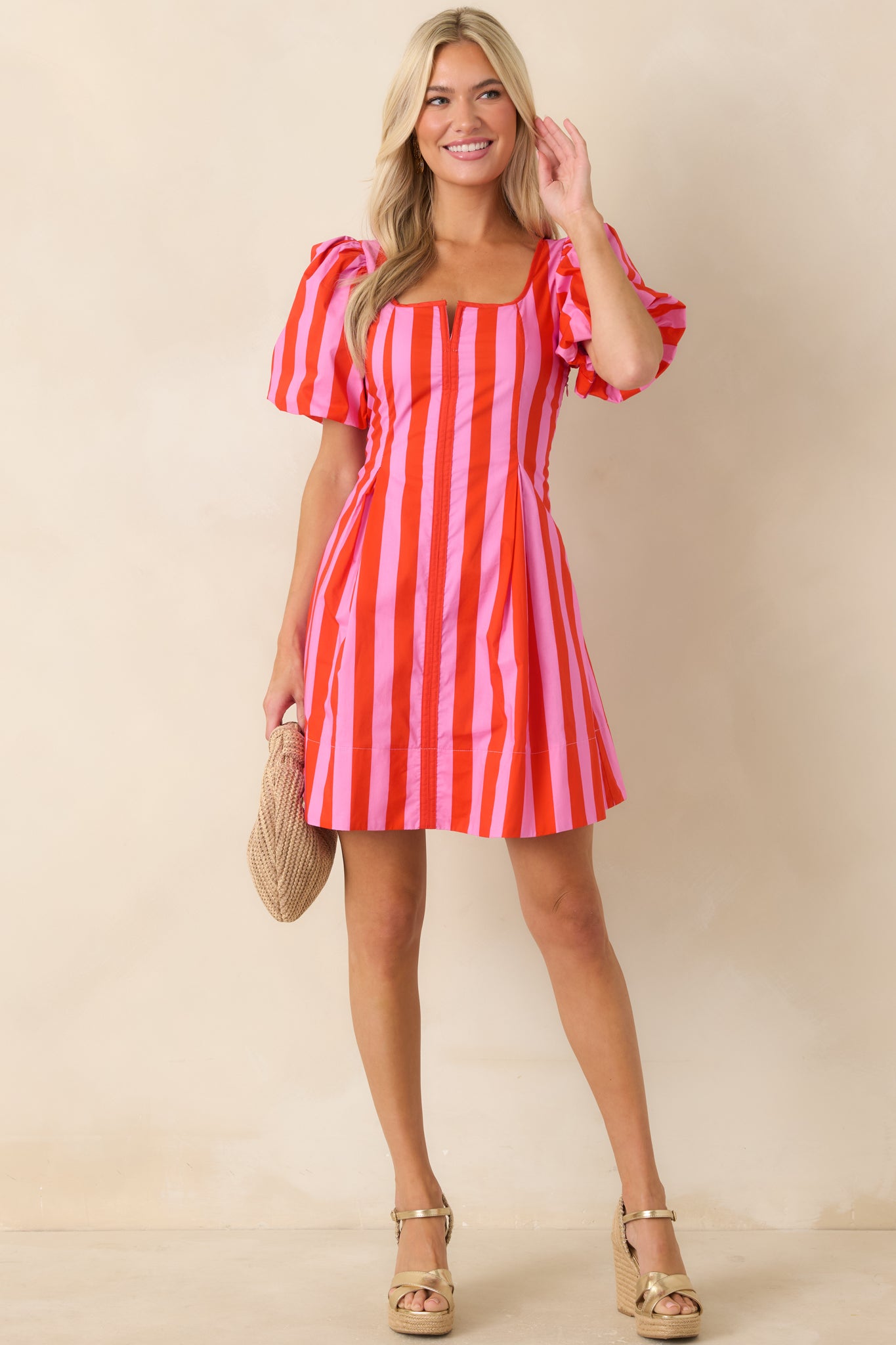 Square neckline cotton mini dress featuring a fitted bodice, puff sleeves, and softly flared skirt.