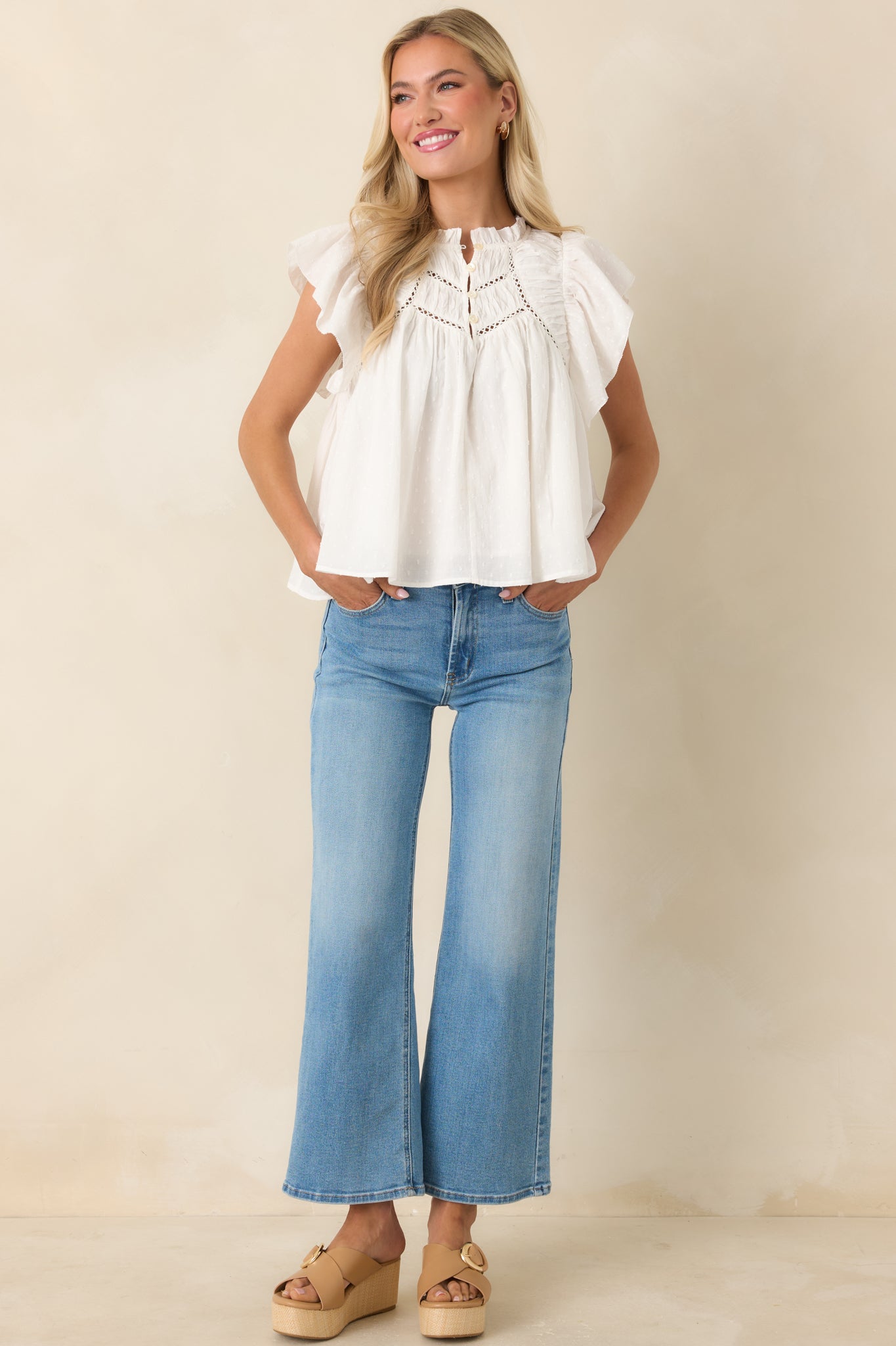 Relaxed cotton blouse with structured ruffle collar and delicate lace construction.