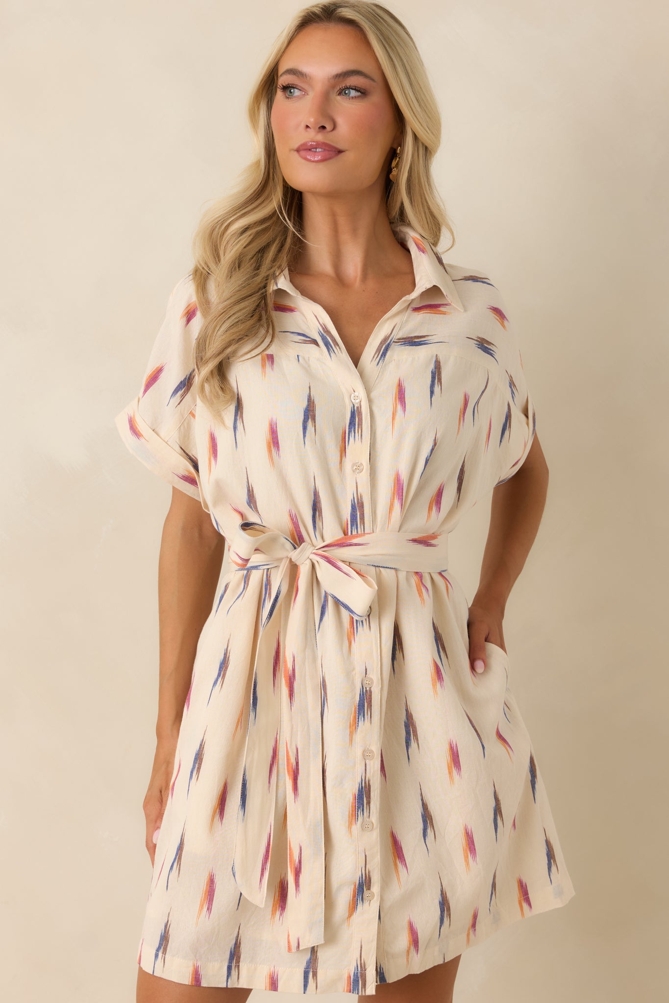 Close front view of the multi print shirt dress emphasizing the self-tie waist belt and artistic brushstroke pattern.