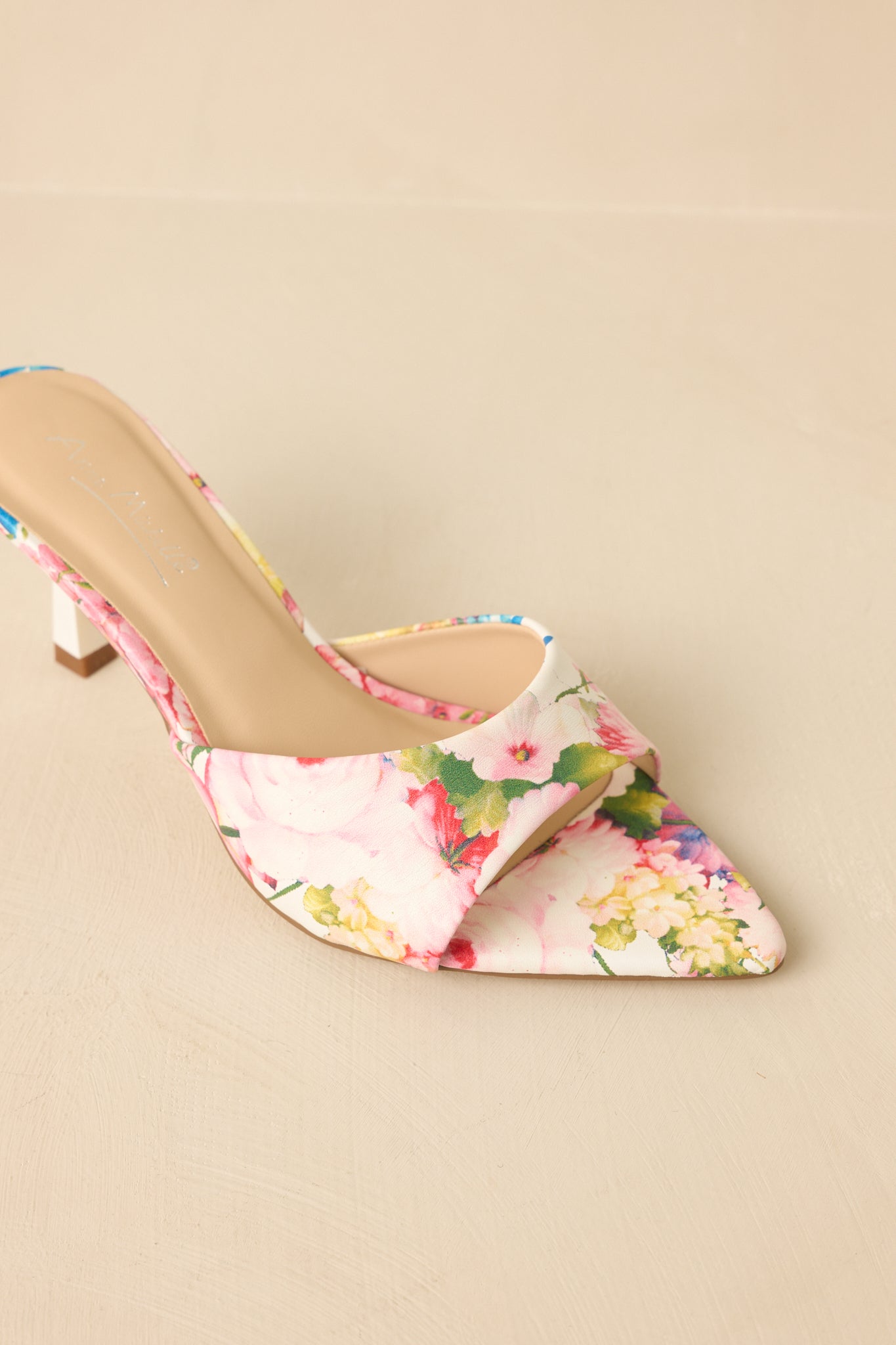 Top-down view emphasizing pointed toe shape and printed design.