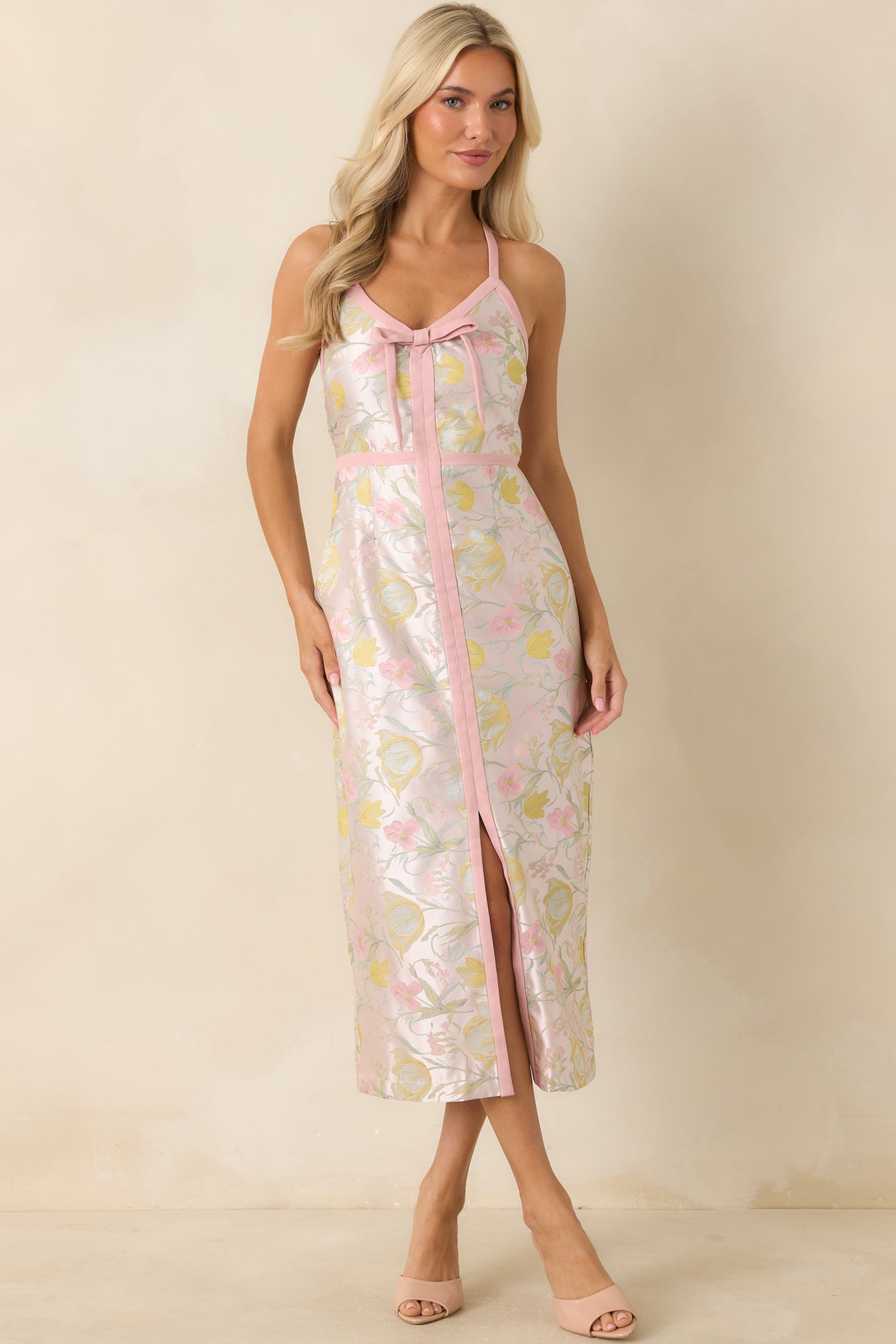 Pink shimmer floral midi dress featuring a floral jacquard fabric, contrast pink trim detailing, and a fitted silhouette with a front slit.