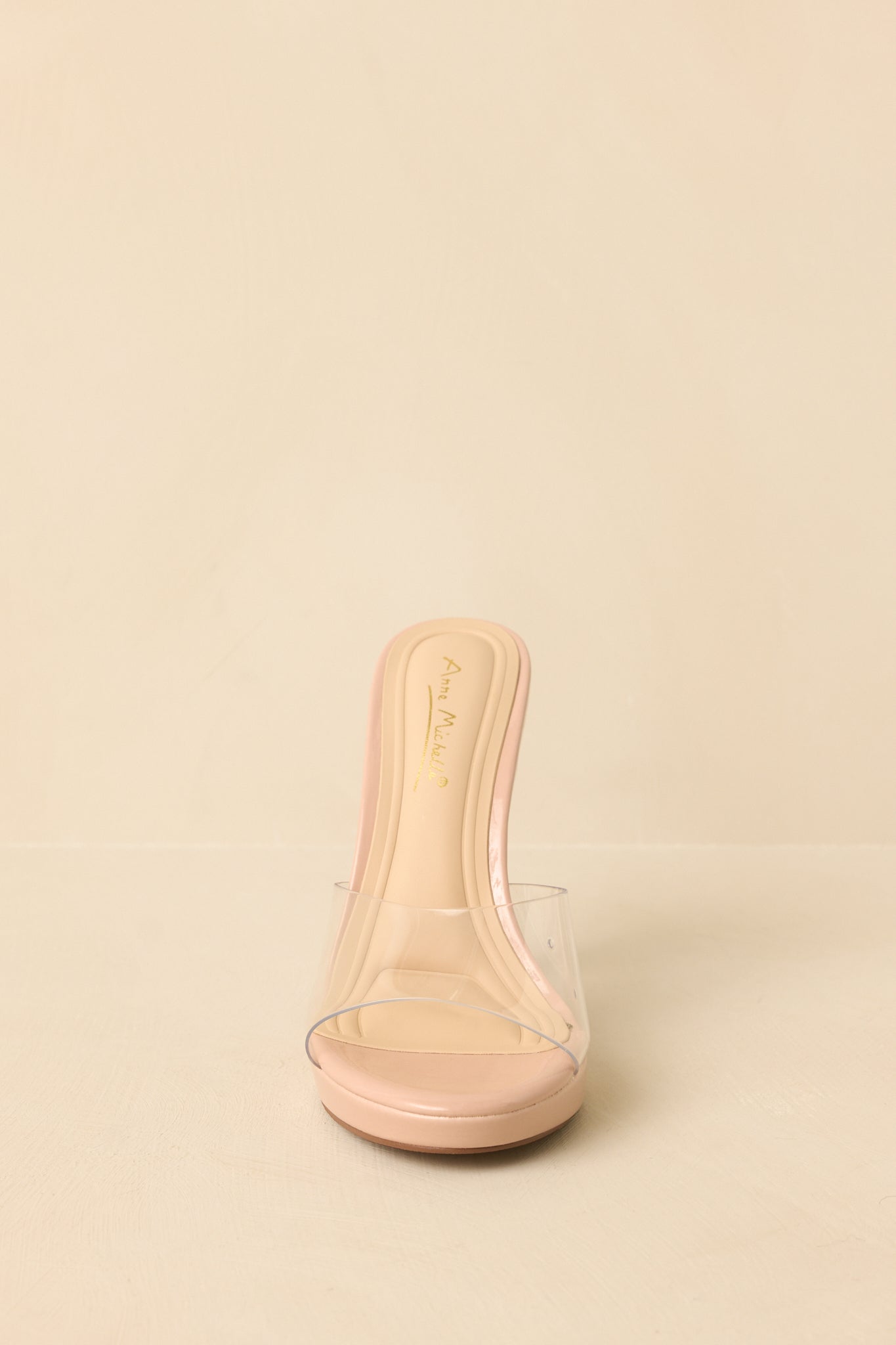 Heels displayed to show the minimalist slip-on construction and refined silhouette.