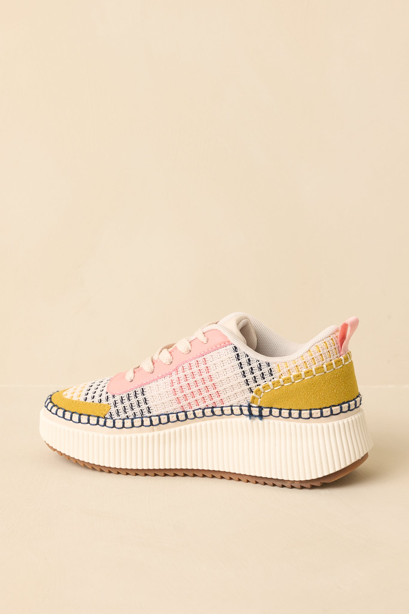 Pink multi lace-up sneakers displaying the full side profile and layered color accents.