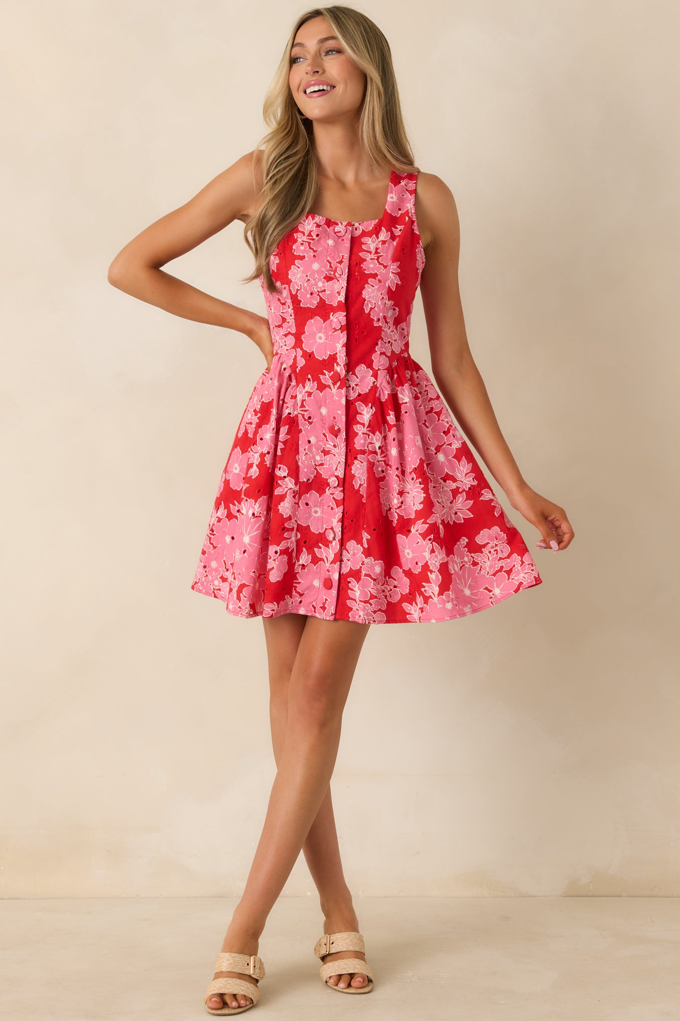 Button-front mini dress with tailored waist and easy, flowing skirt design.