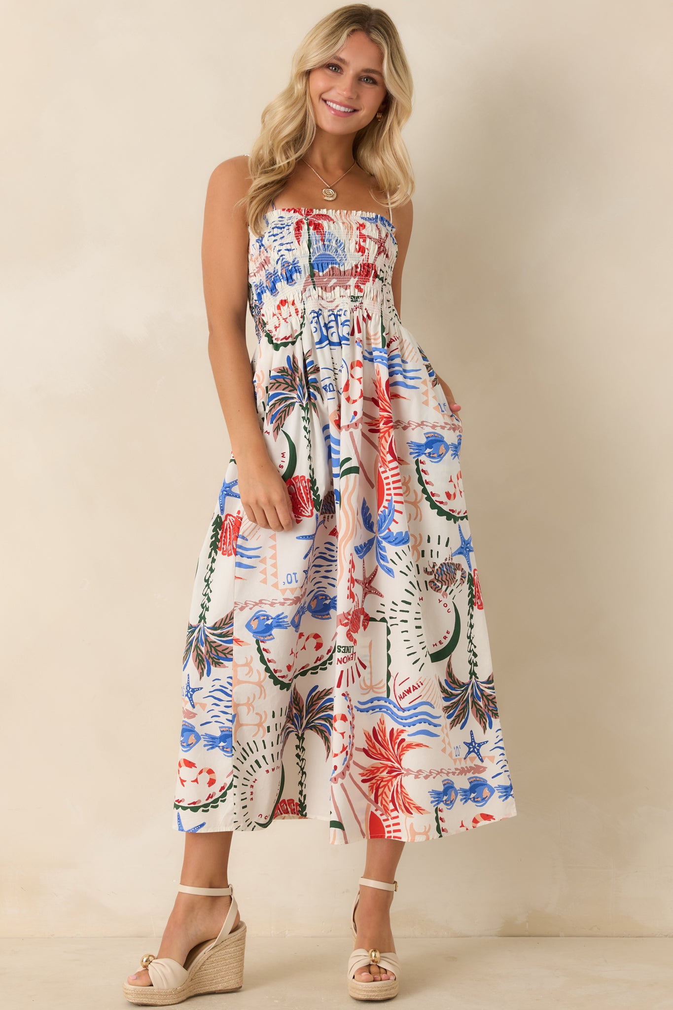 Front full view highlighting the relaxed flowy silhouette and vibrant tropical and seaside motifs scattered across the lightweight fabric.
