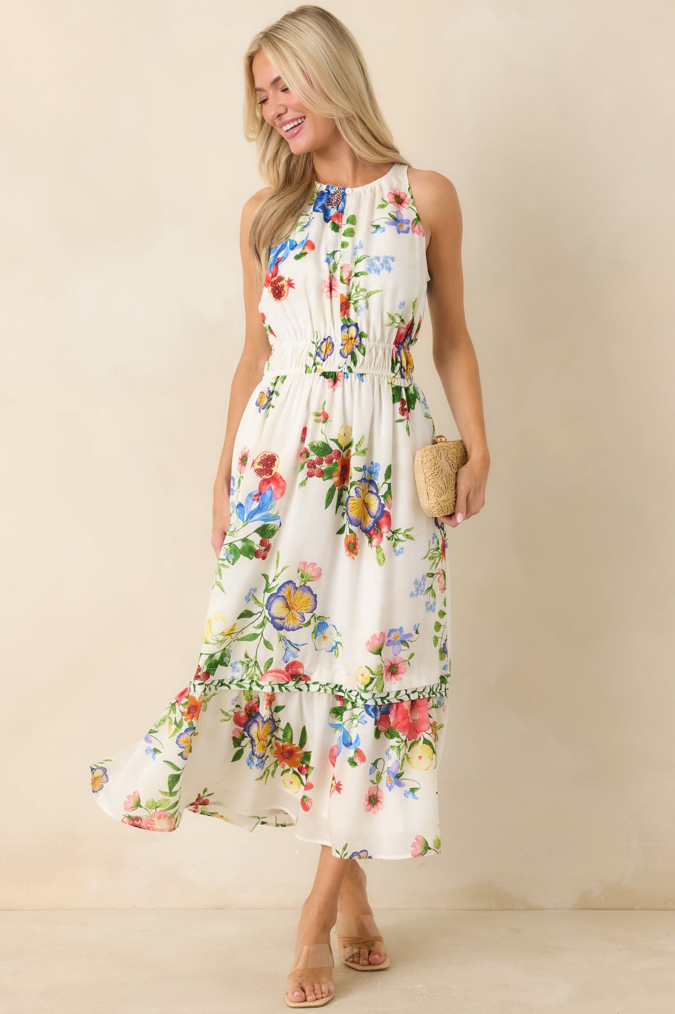 Floral and fruit-inspired midi dress with sleeveless design and softly gathered neckline.