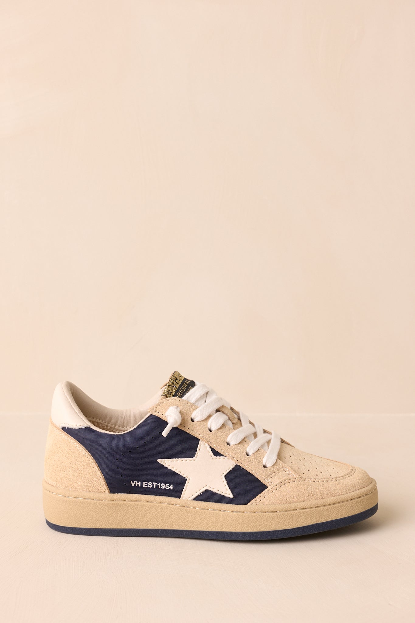 Cropped side view highlighting the perforated toe area and smooth transition into the tonal rubber outsole.