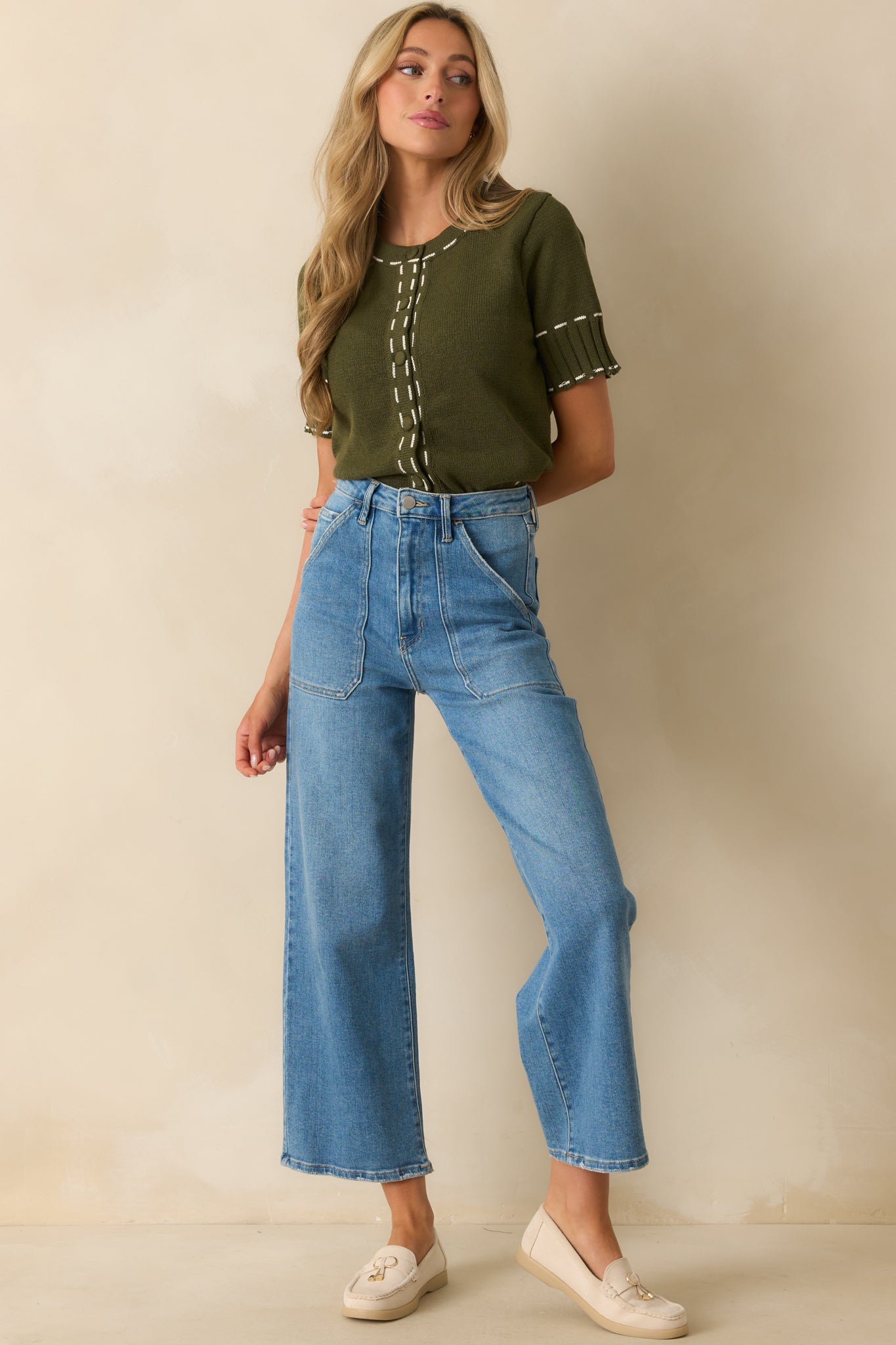 Relaxed-fit olive green top with ribbed hems and short sleeves.