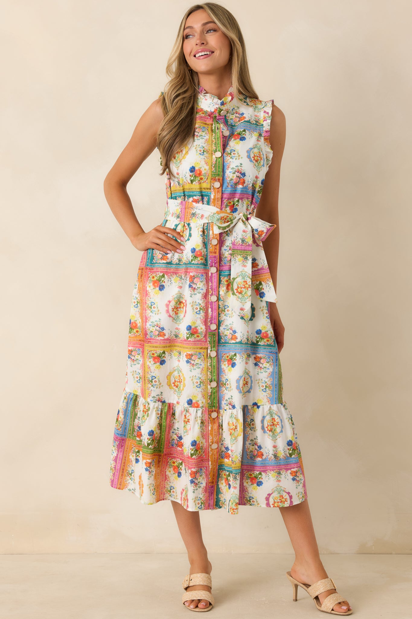 100% cotton midi dress showcasing a ruffled neckline and armhole trim with a colorful tile print.