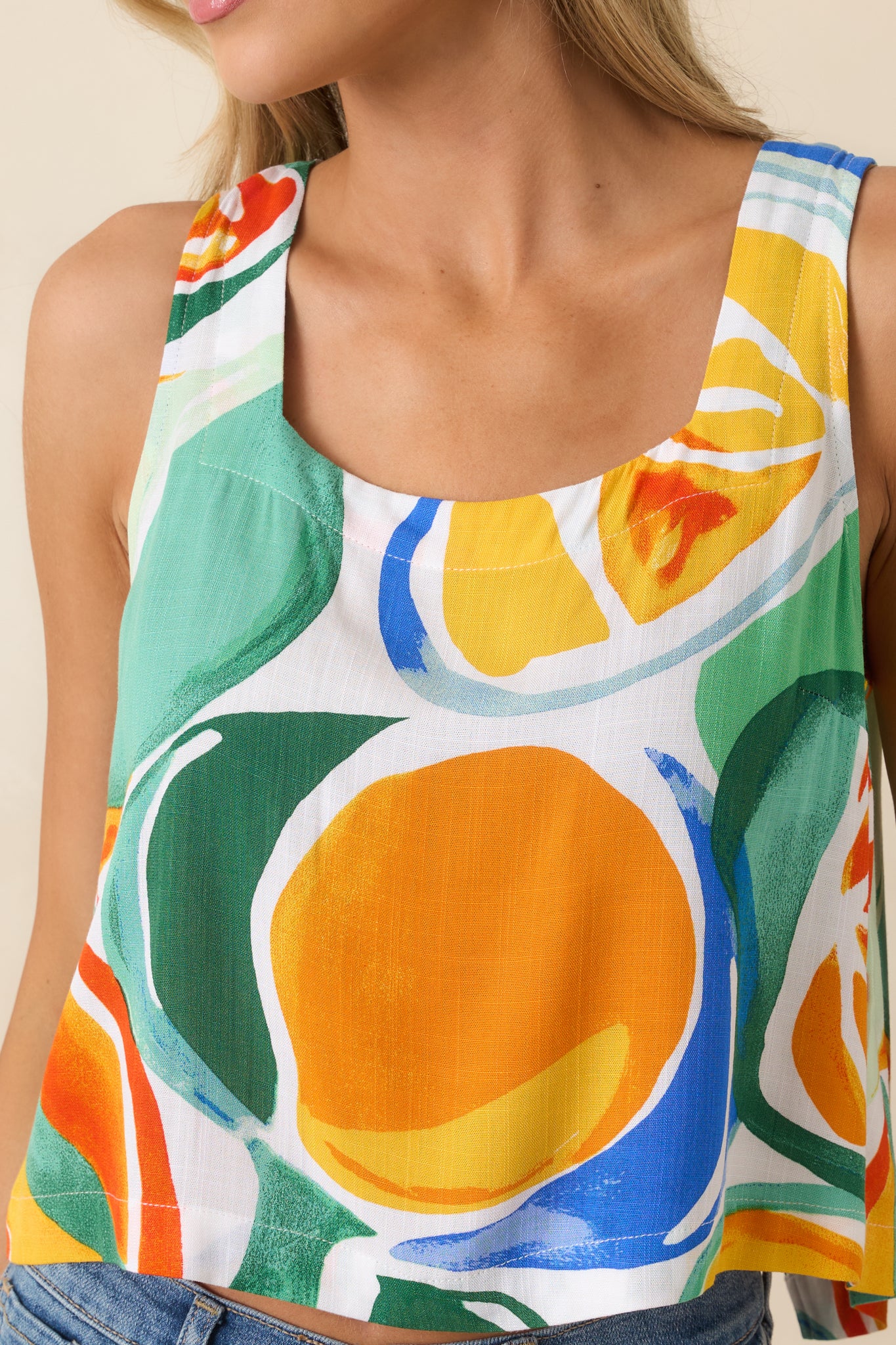 Close-up of the lightweight woven fabric showcasing the vibrant citrus-inspired print and fine texture.