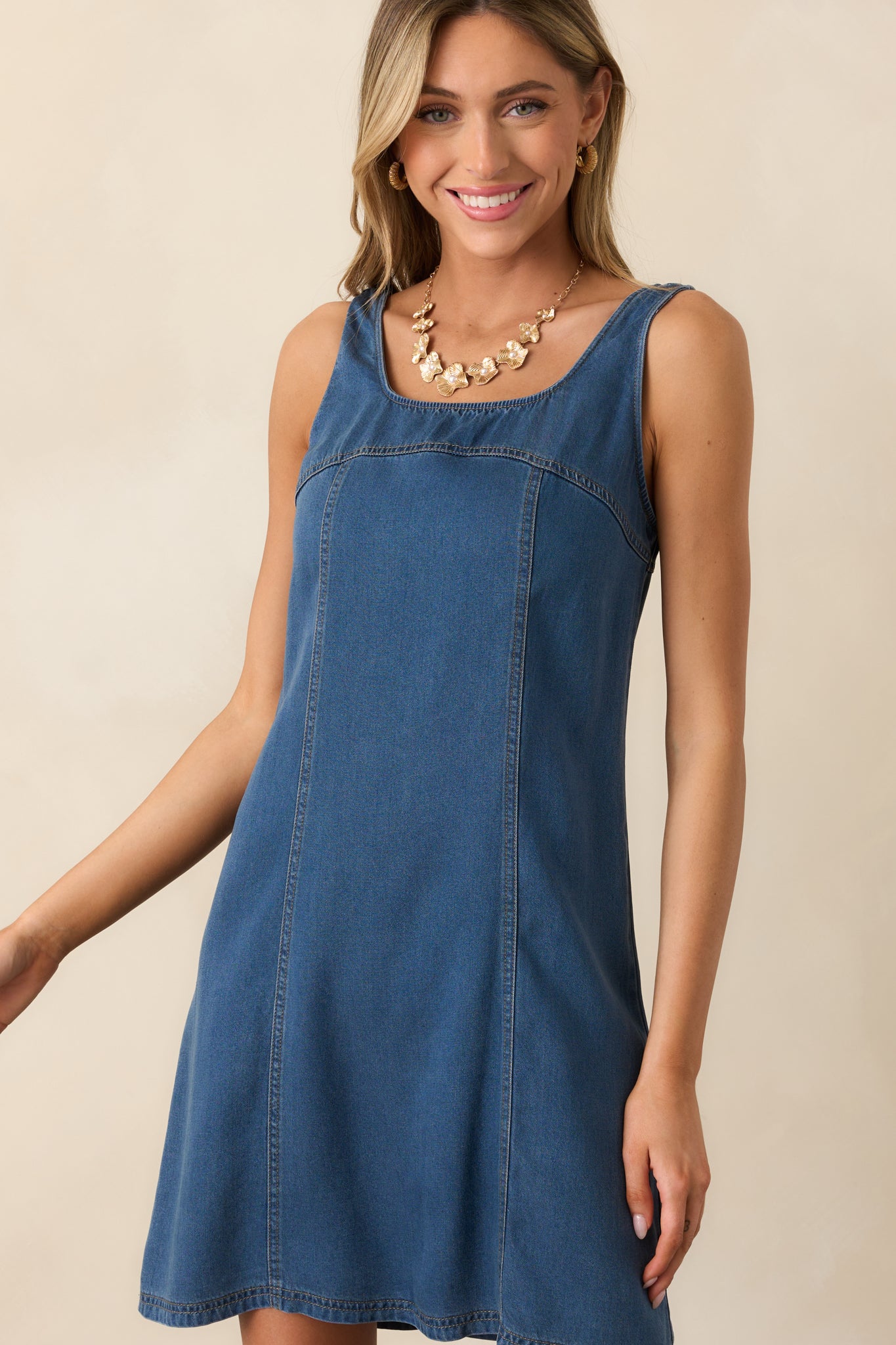 An angled crop displaying the sleeveless cut and the smooth transitions of the paneling.