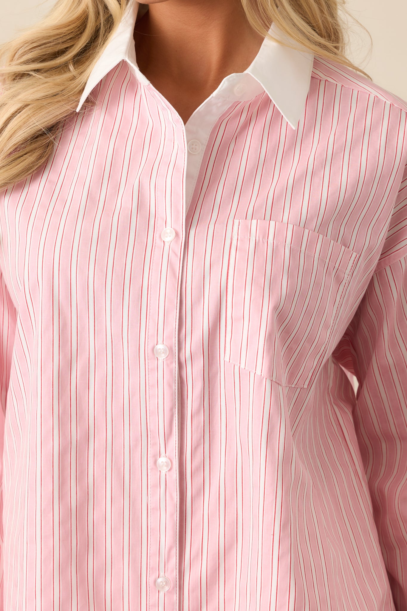 A detailed view of the stripe print and button front, showcasing the soft fabric and clean design of the blouse.