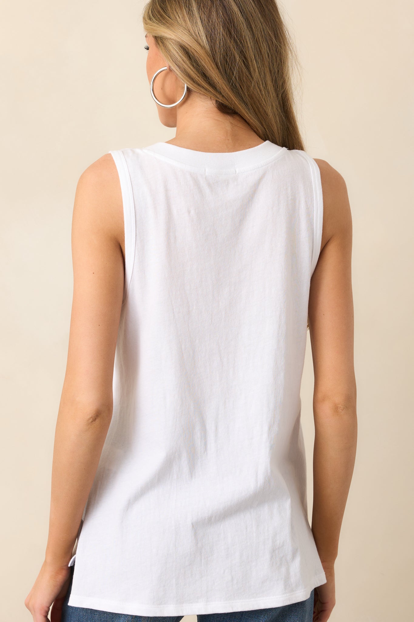 A back view of the white tank, displaying its smooth back panel and effortless fit.