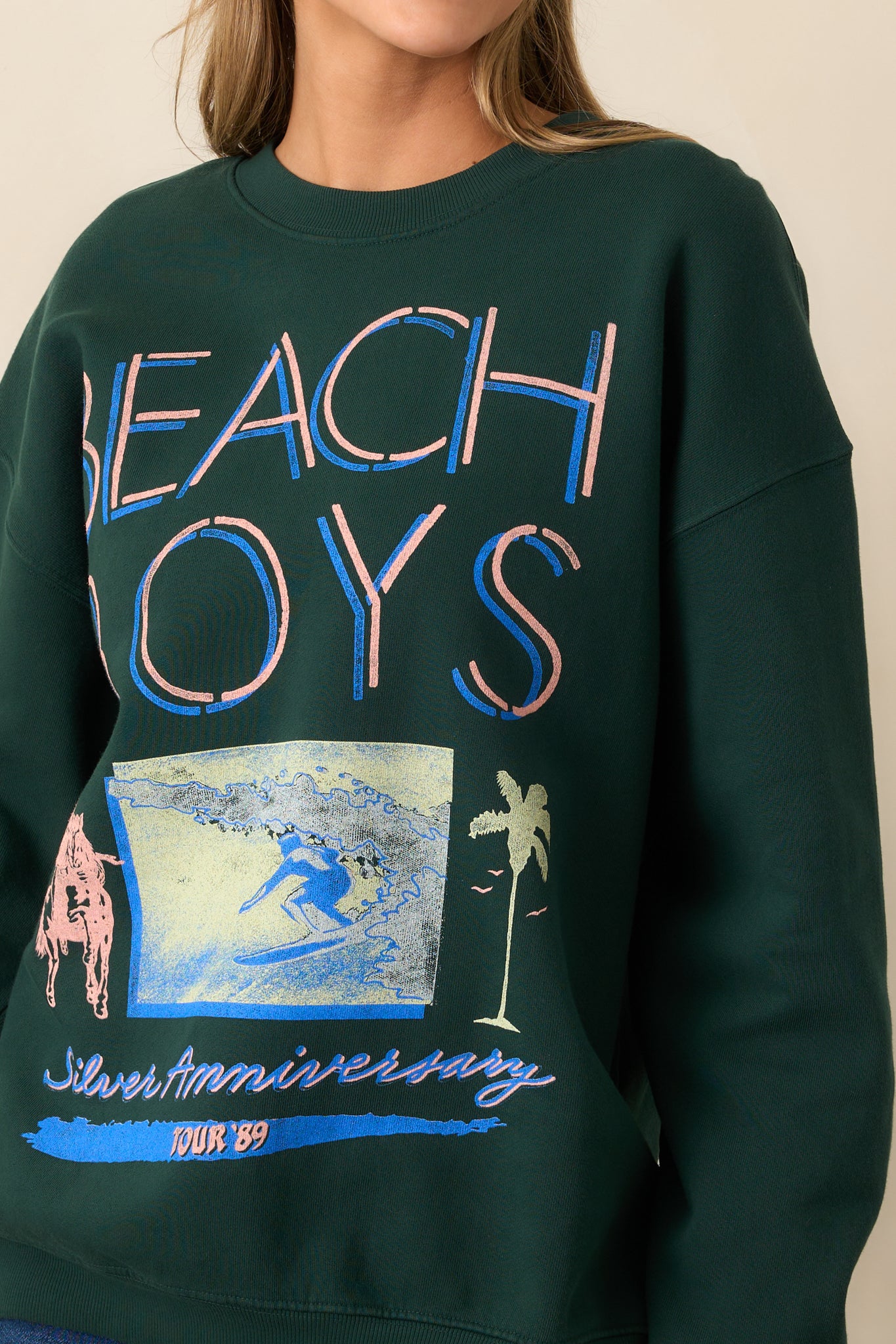 A detailed look at the surf graphic, emphasizing the intricate design and vintage tour lettering.