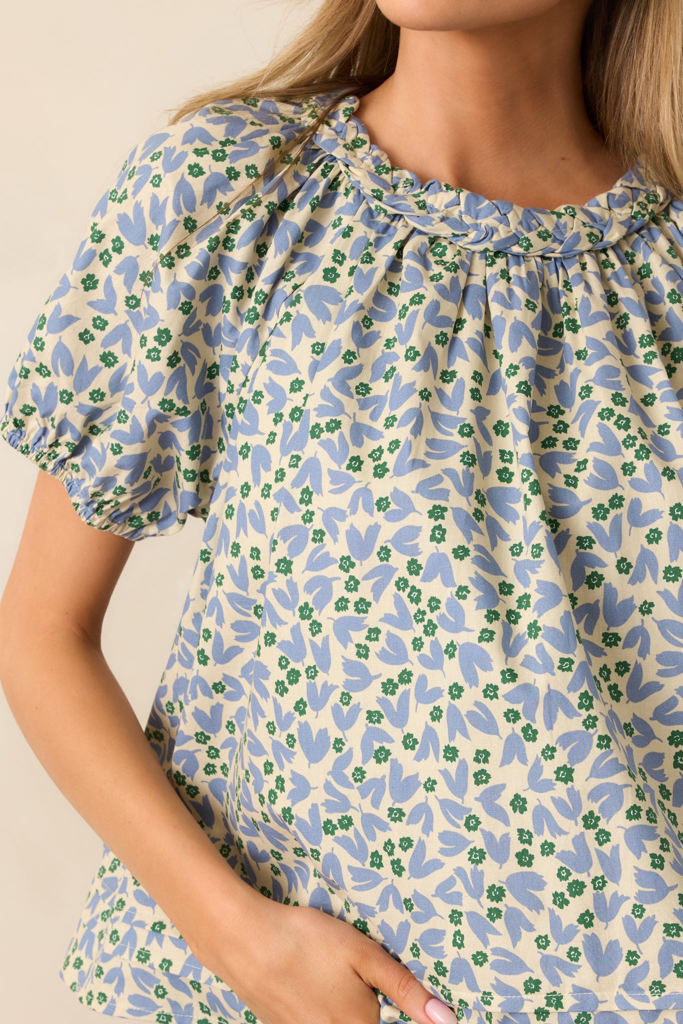 Detailed close-up of the blouse's braided collar and keyhole closure, showing texture and craftsmanship.