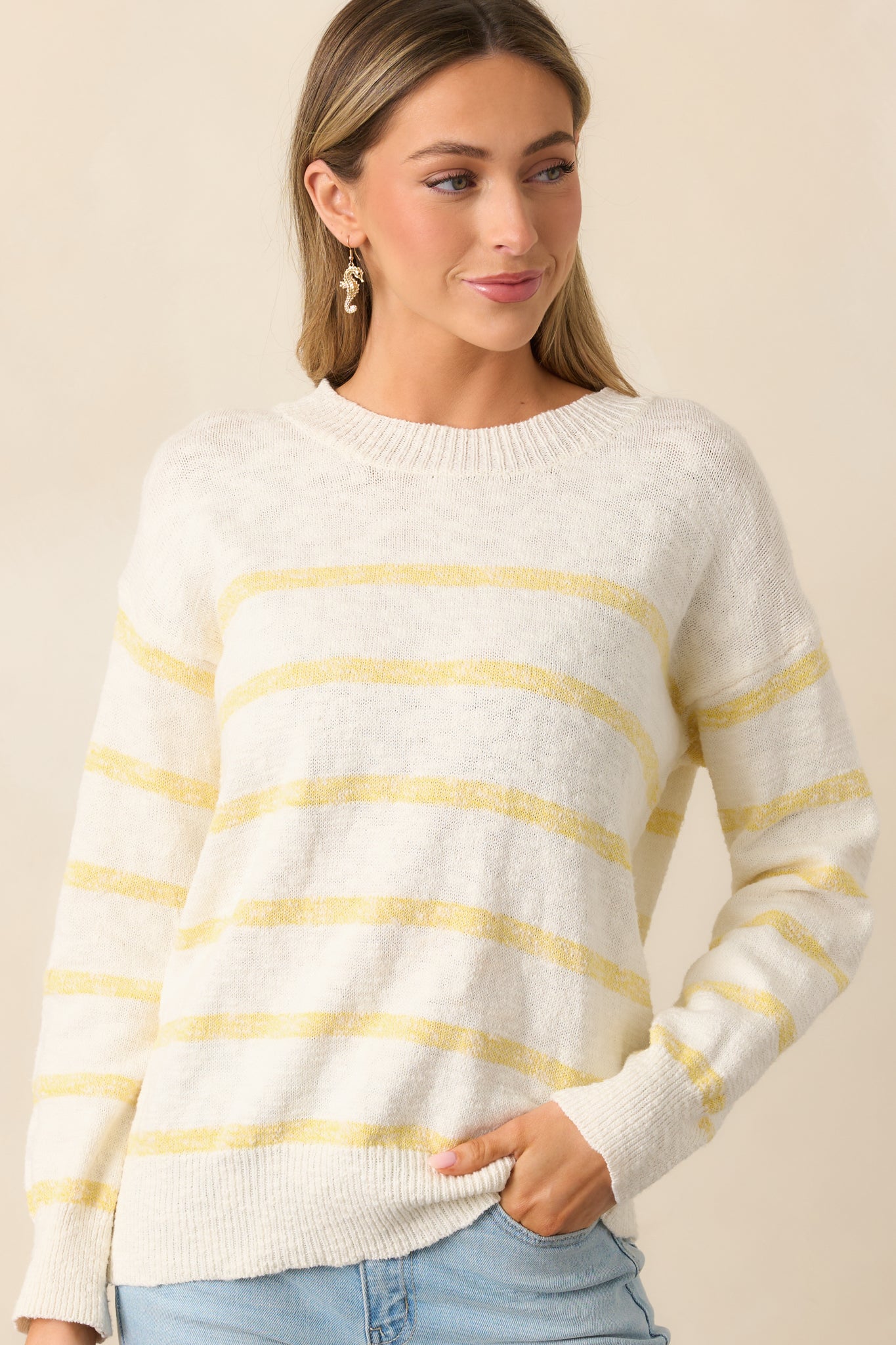 The yellow stripe detailing adds a pop of color, complementing the lightweight knit fabric.
