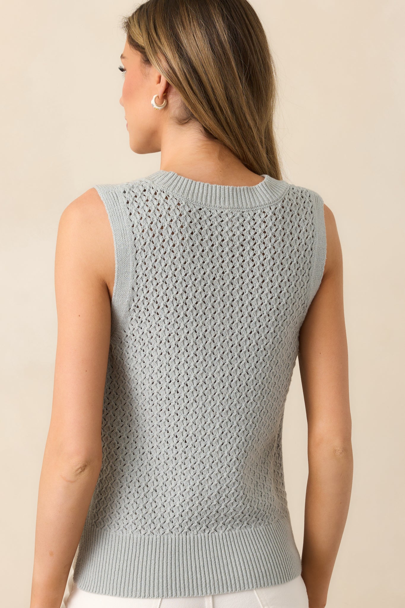 The back of the top continues the open knit design, maintaining its breathable and lightweight feel from every angle.