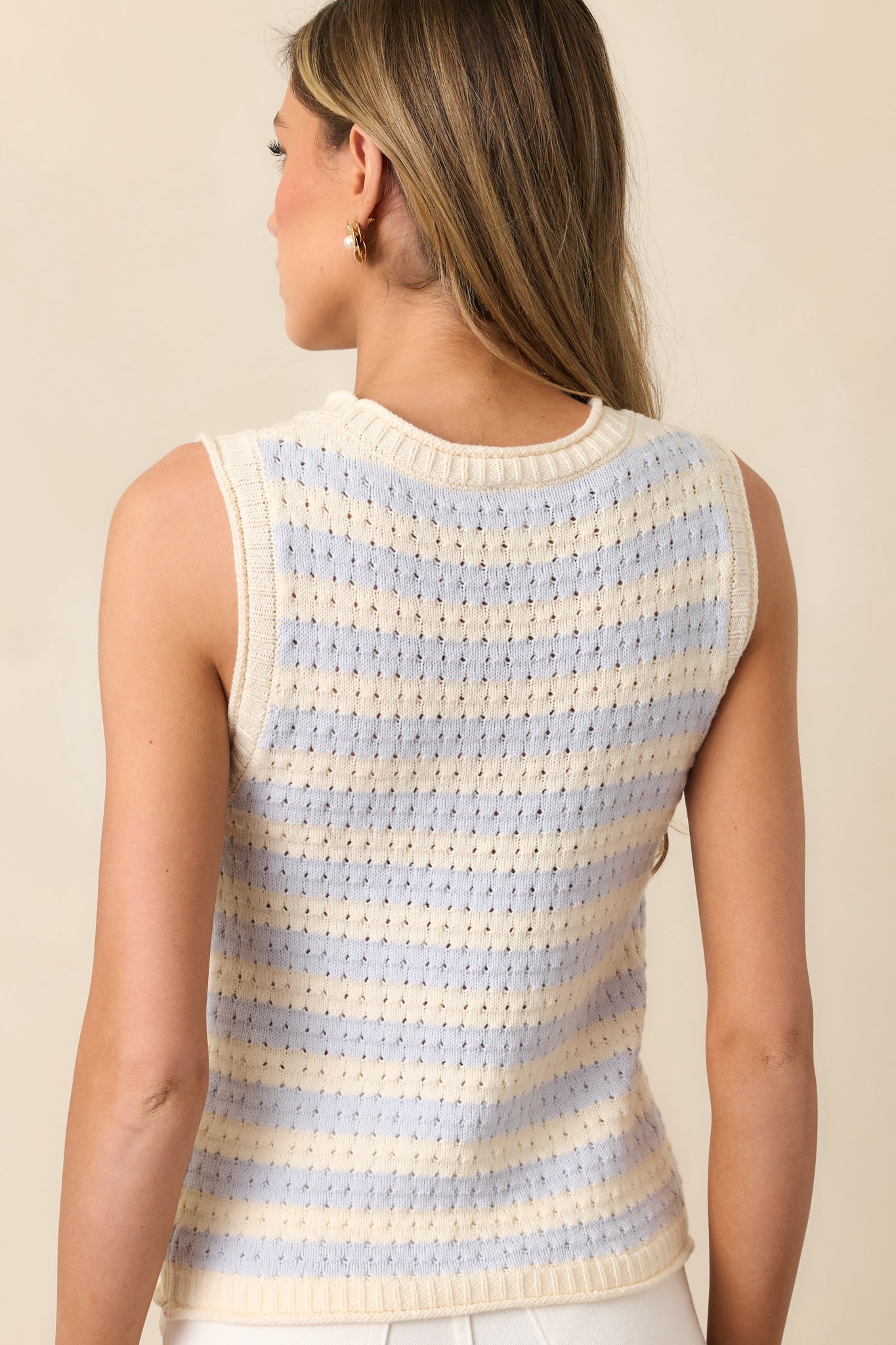 The back of the blue stripe tank top, showing the clean, sleeveless design and ribbed hem finishing.