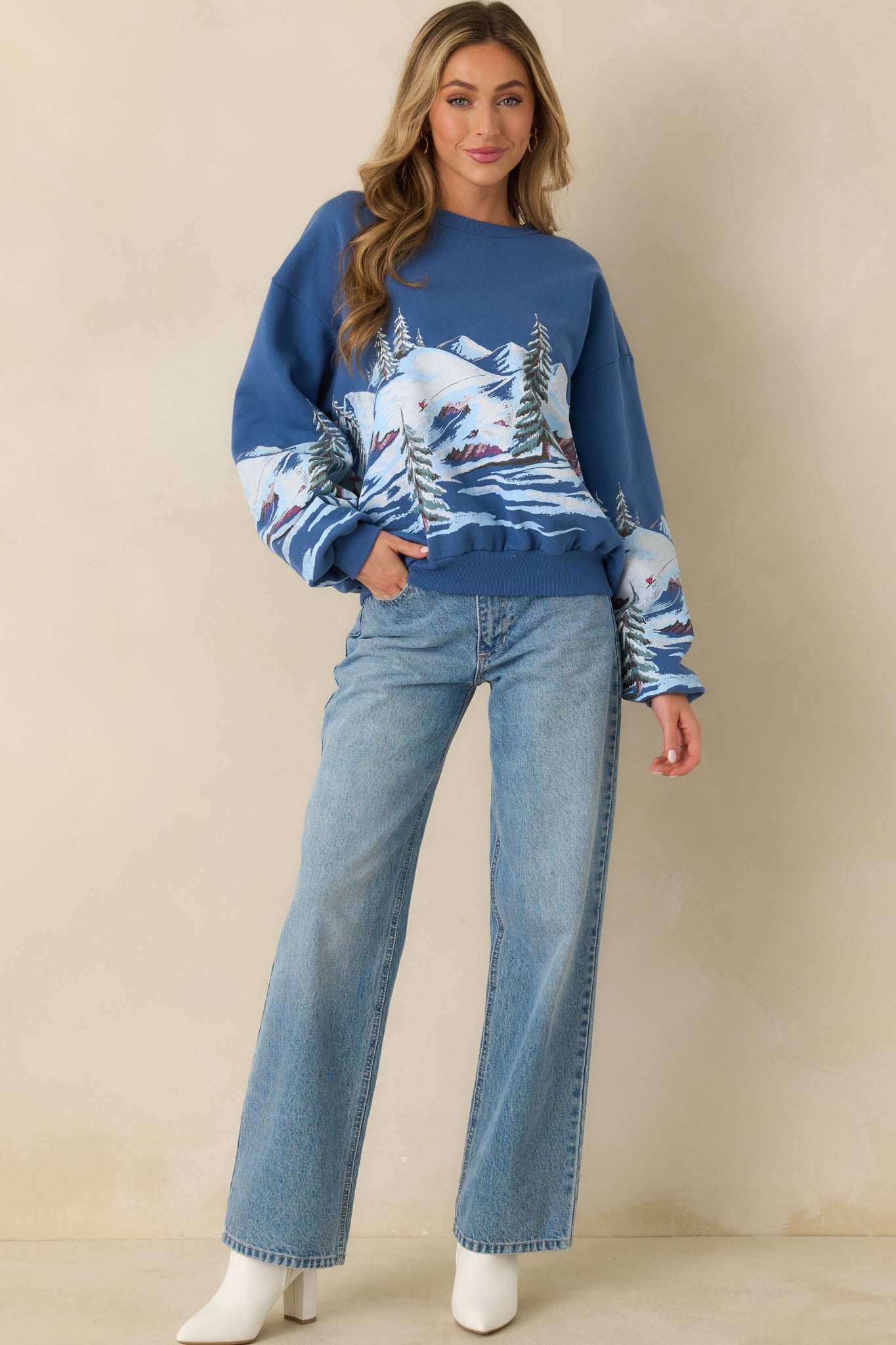 Dark blue graphic sweatshirt showing long sleeves, ribbed trim, and a comfortable everyday silhouette.
