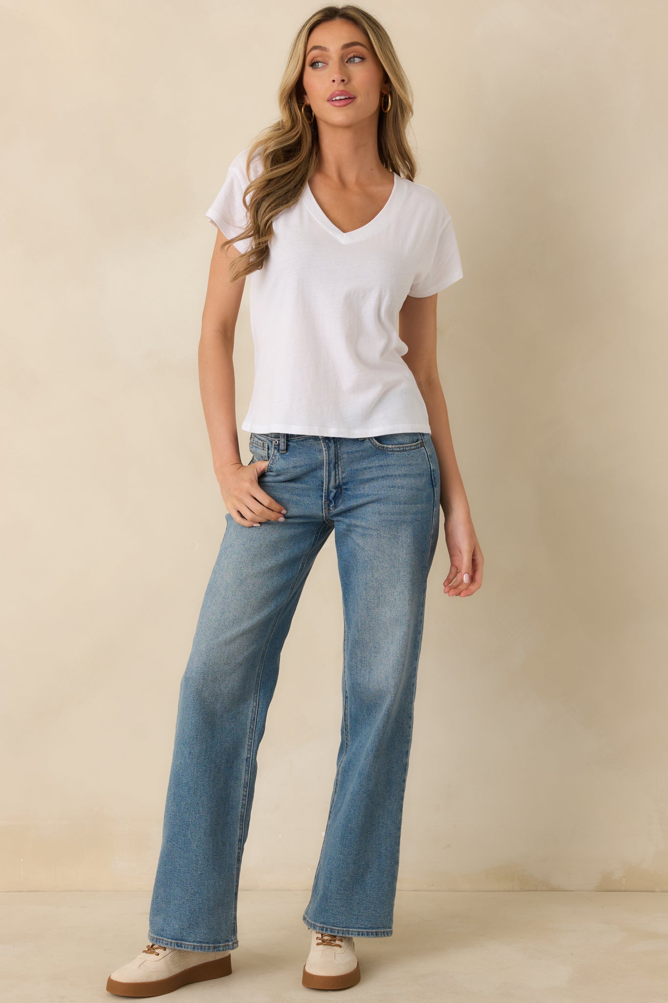 Front view of white tee featuring V-neckline, airy fabric, and easy everyday silhouette.