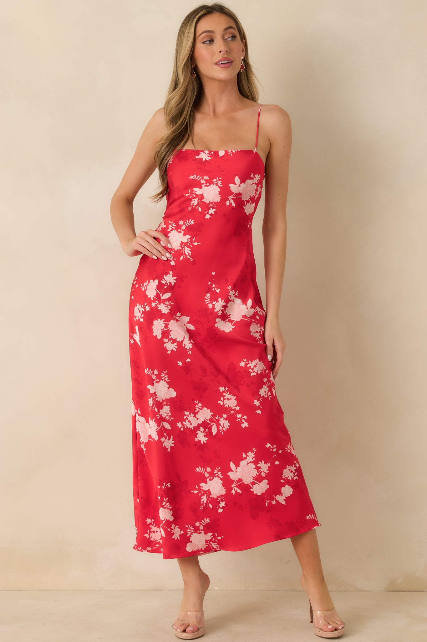 Lightweight red floral maxi dress designed with a smooth woven fabric and an elegant, fluid silhouette.