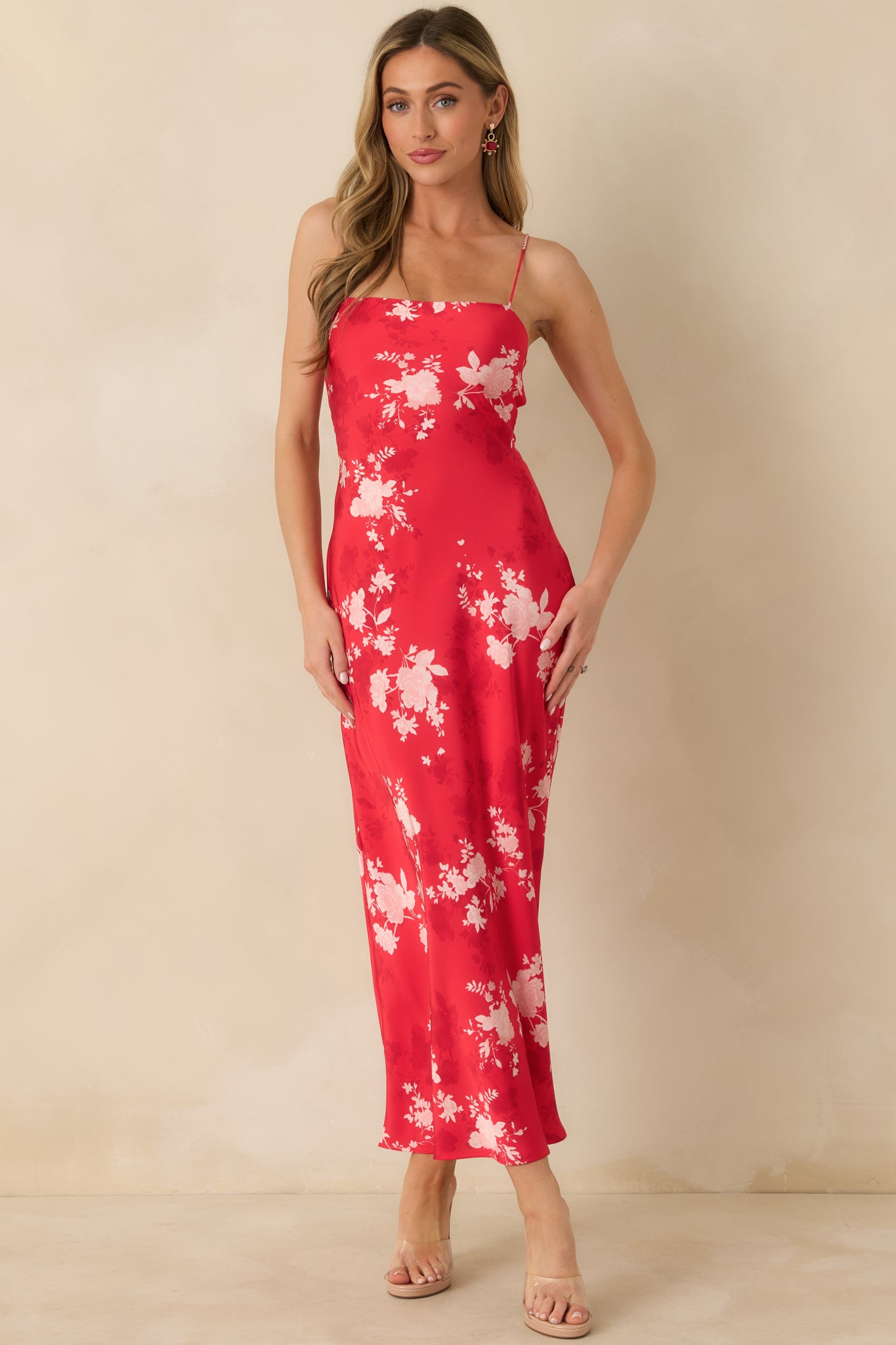 Full-length red floral dress with delicate spaghetti straps and an easy, graceful fit.