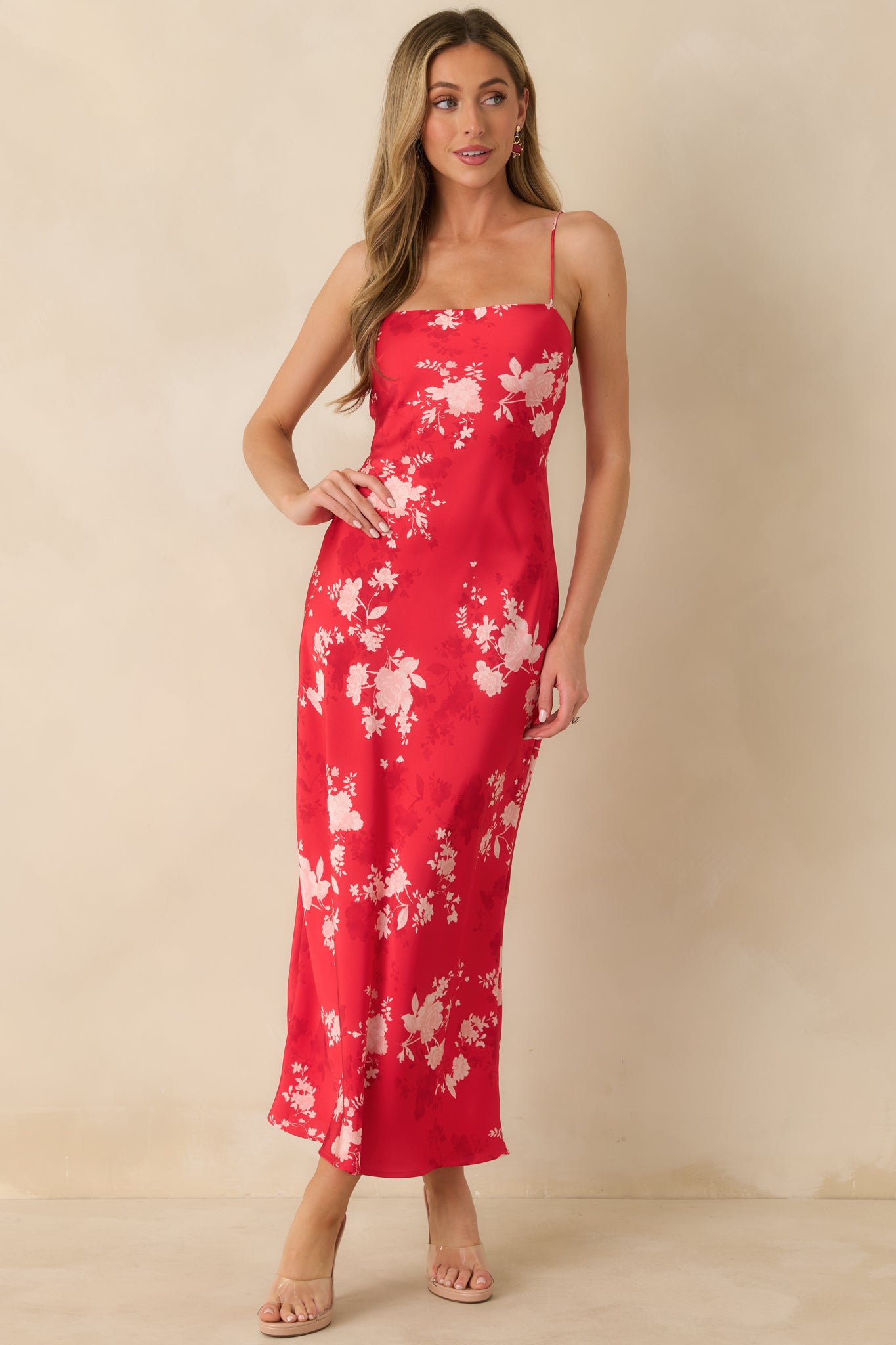 Red floral maxi dress highlighting its fluid movement and polished, lightweight construction.
