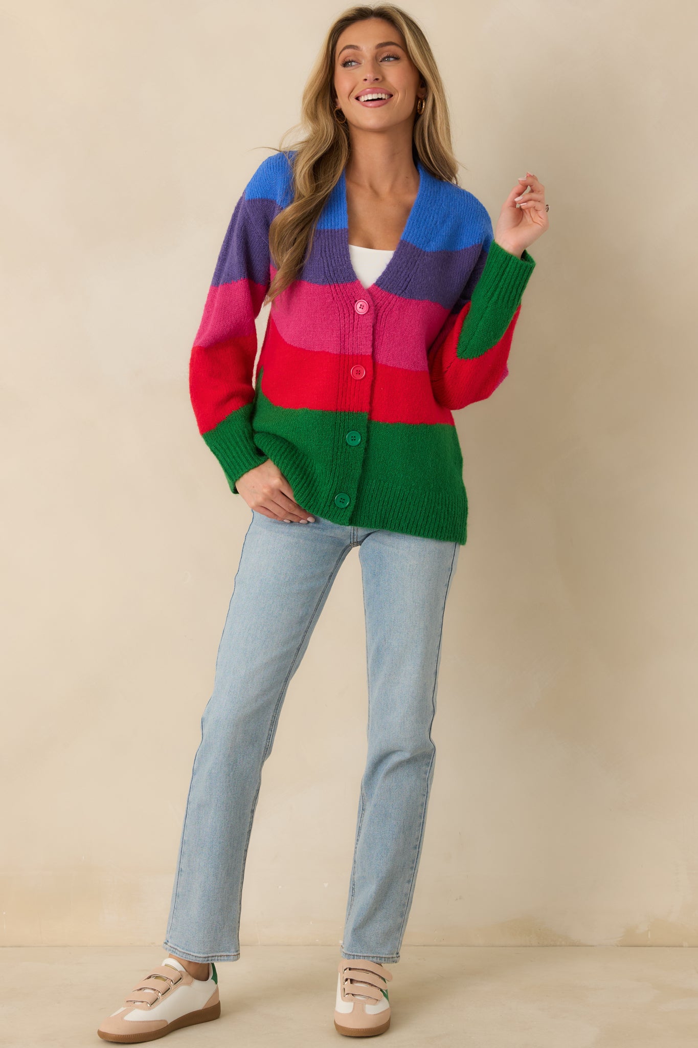 Multi colorblock cardigan with a V-neckline, button-front closure, and relaxed knit silhouette.