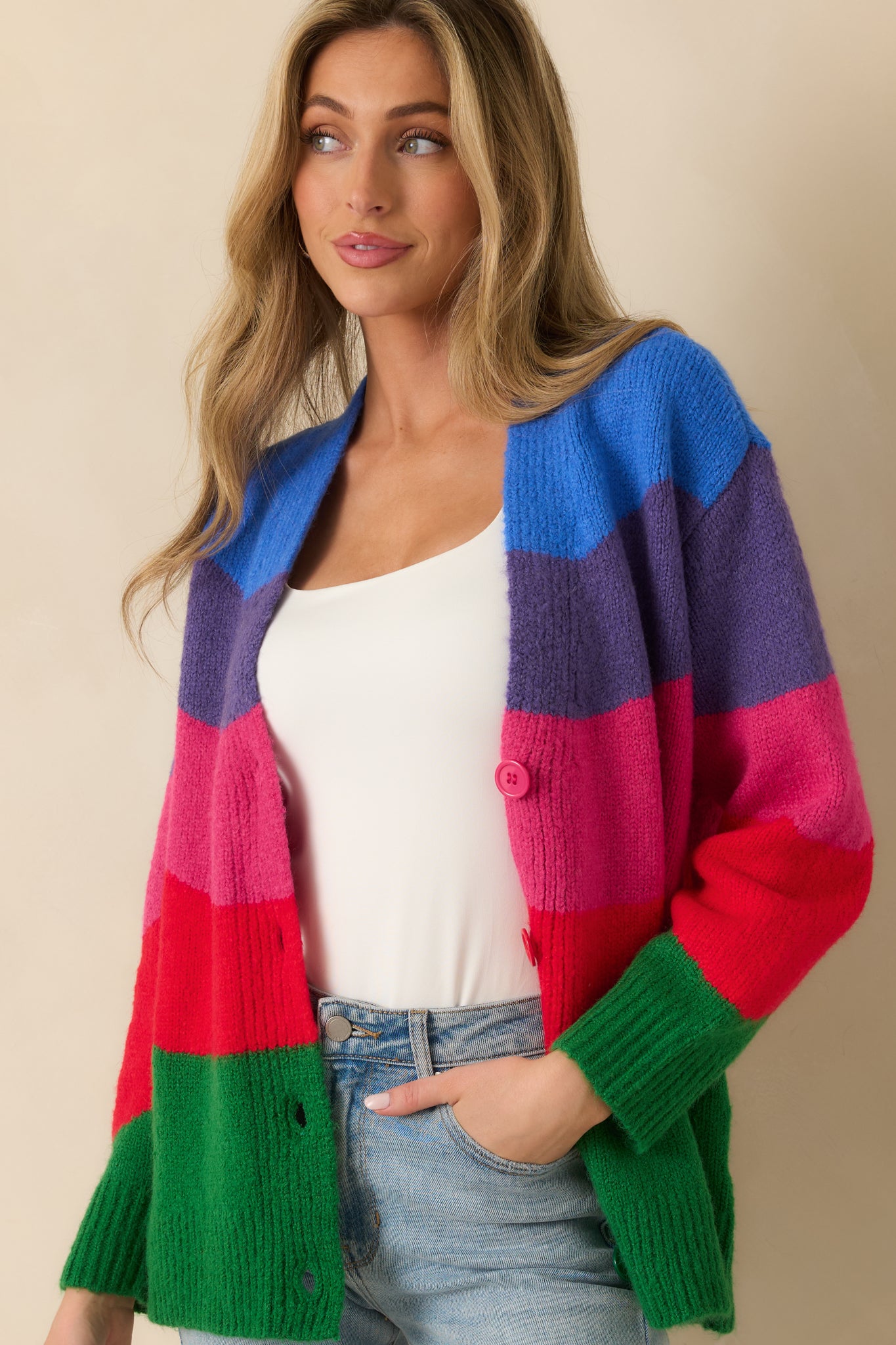 Close-up of the soft knit fabric and colorblock pattern on the cardigan’s front panel.