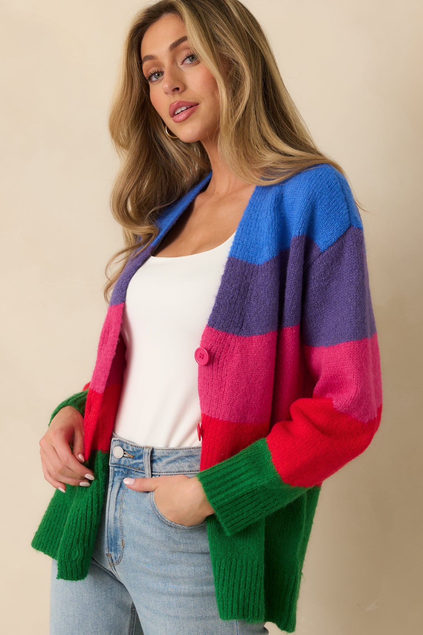 Cropped look at the ribbed hem and colorblock pattern across the knit cardigan.