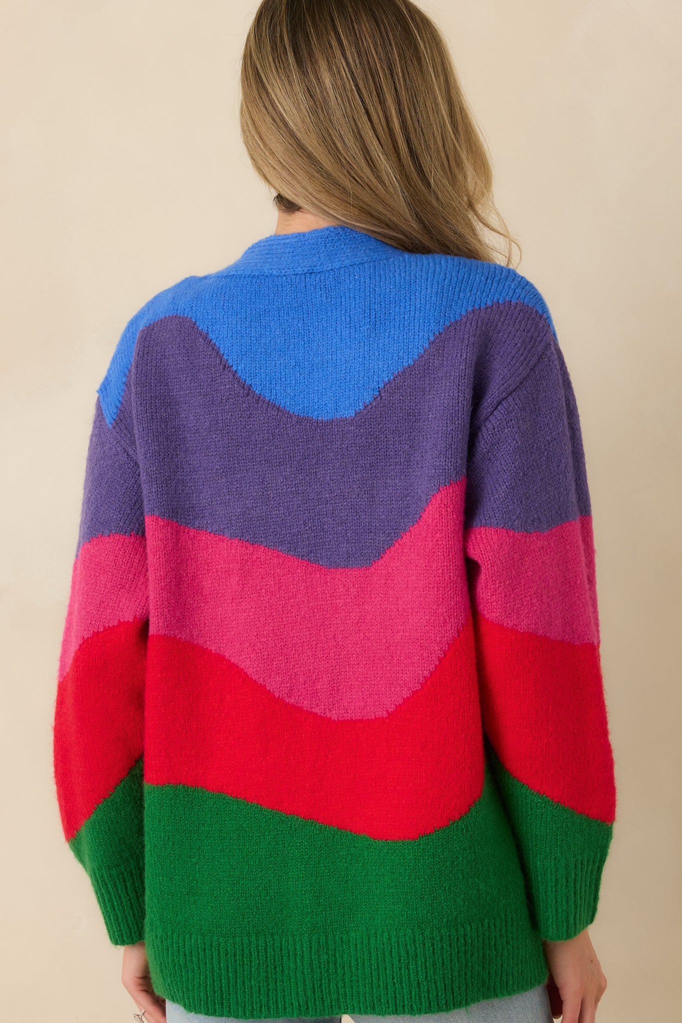 Rear view of the multi colorblock cardigan highlighting the relaxed silhouette and smooth knit construction.