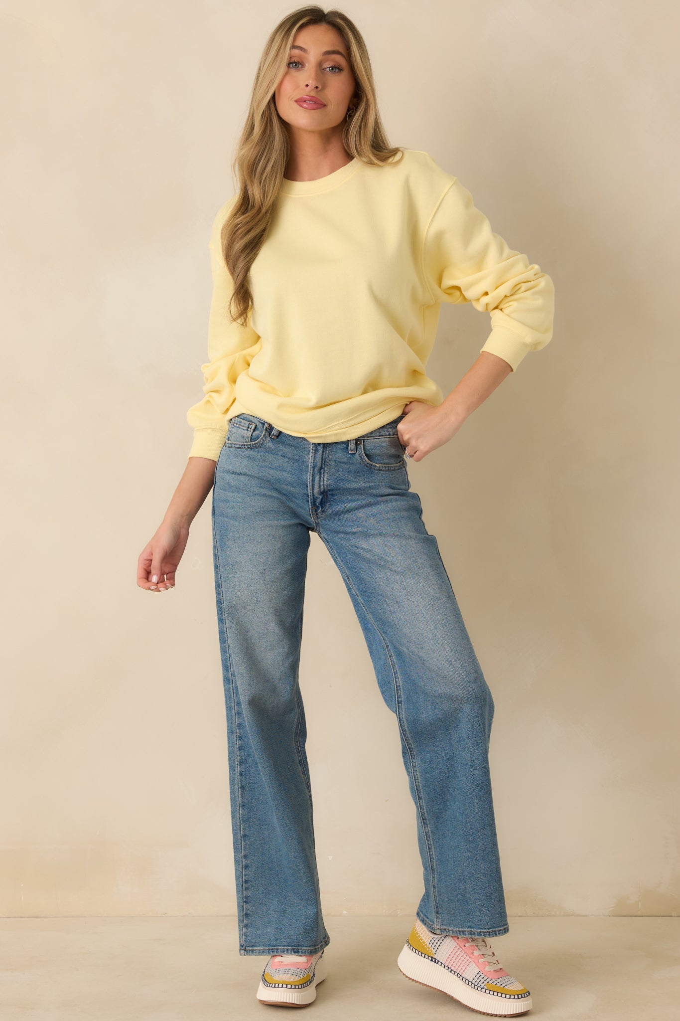 Yellow fleece sweatshirt with a relaxed silhouette, classic crew neckline, and long sleeves finished with ribbed cuffs and hem.
