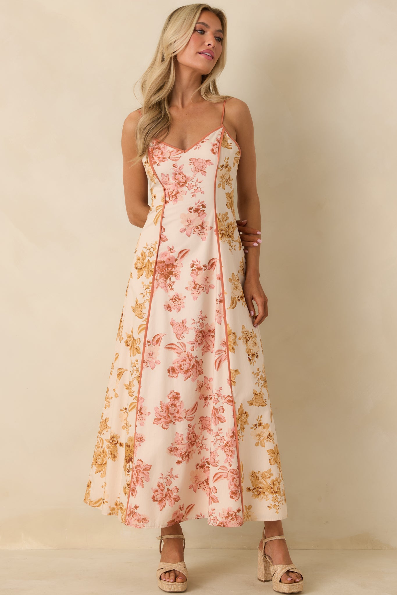 Flowing rose pink and honey yellow maxi dress with floral pattern panels and hidden back zipper.
