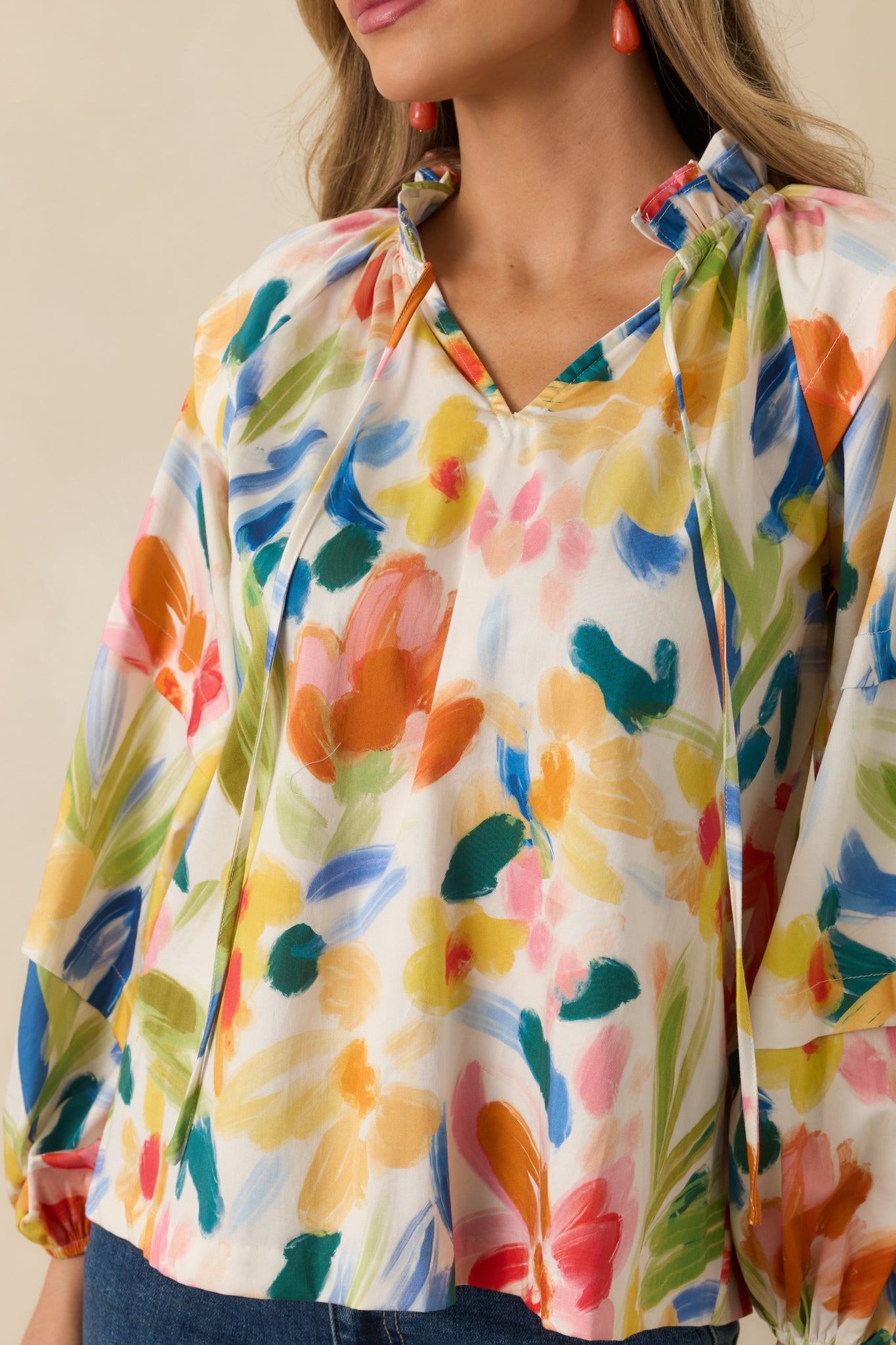 Detailed look at the abstract floral print, elastic cuff finish, and softly gathered cotton fabric.