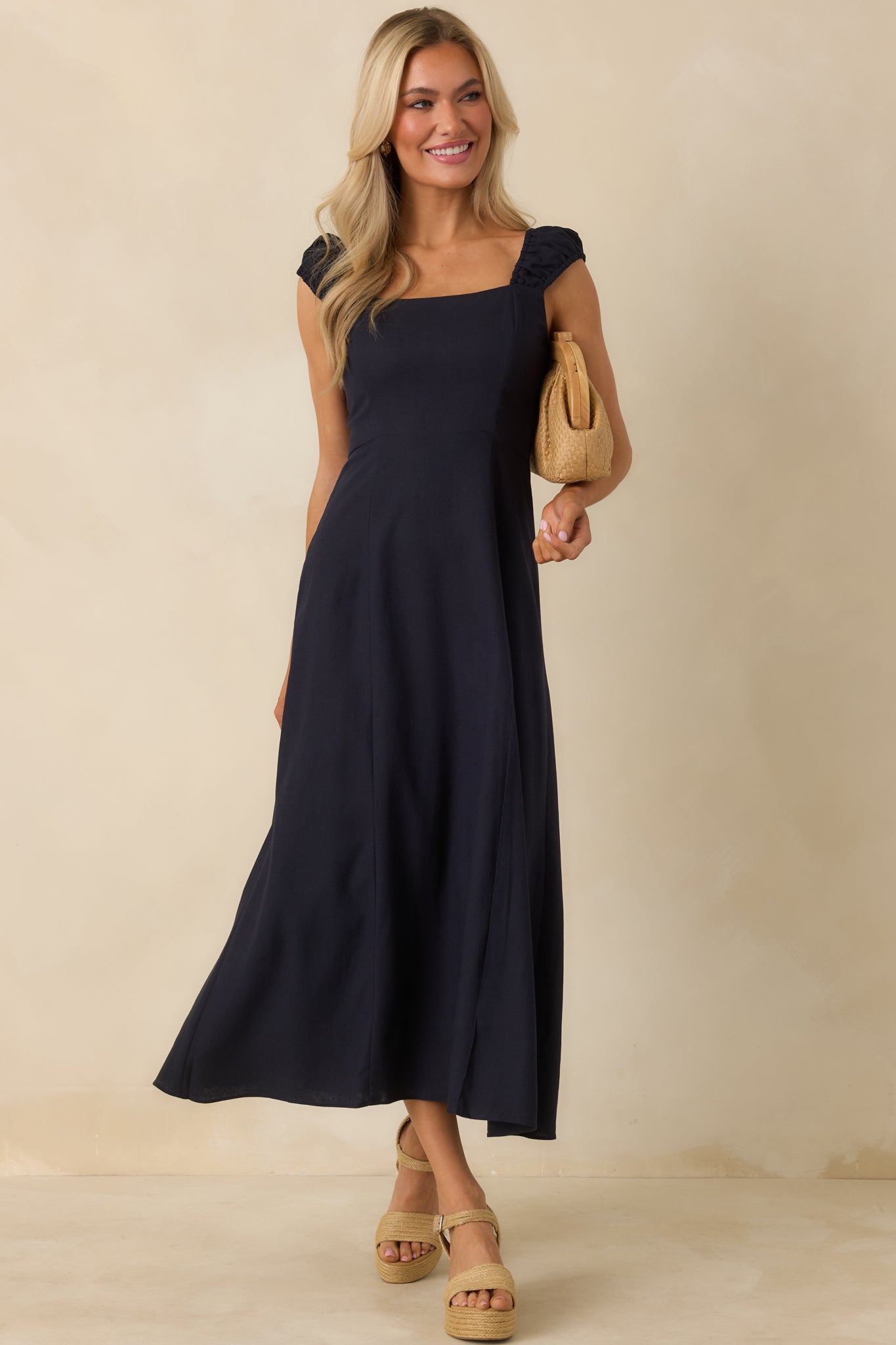 Full front-facing image emphasizing the fitted bodice and midi-length silhouette.