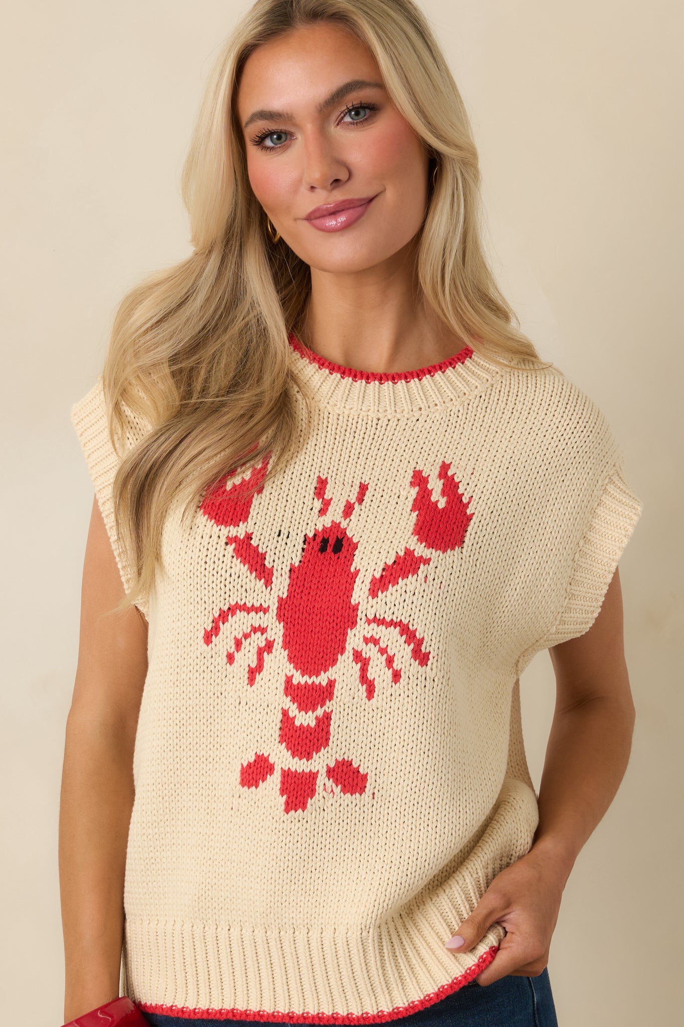 Front-facing crop emphasizing the relaxed fit and smooth cotton blend fabric of the sweater.