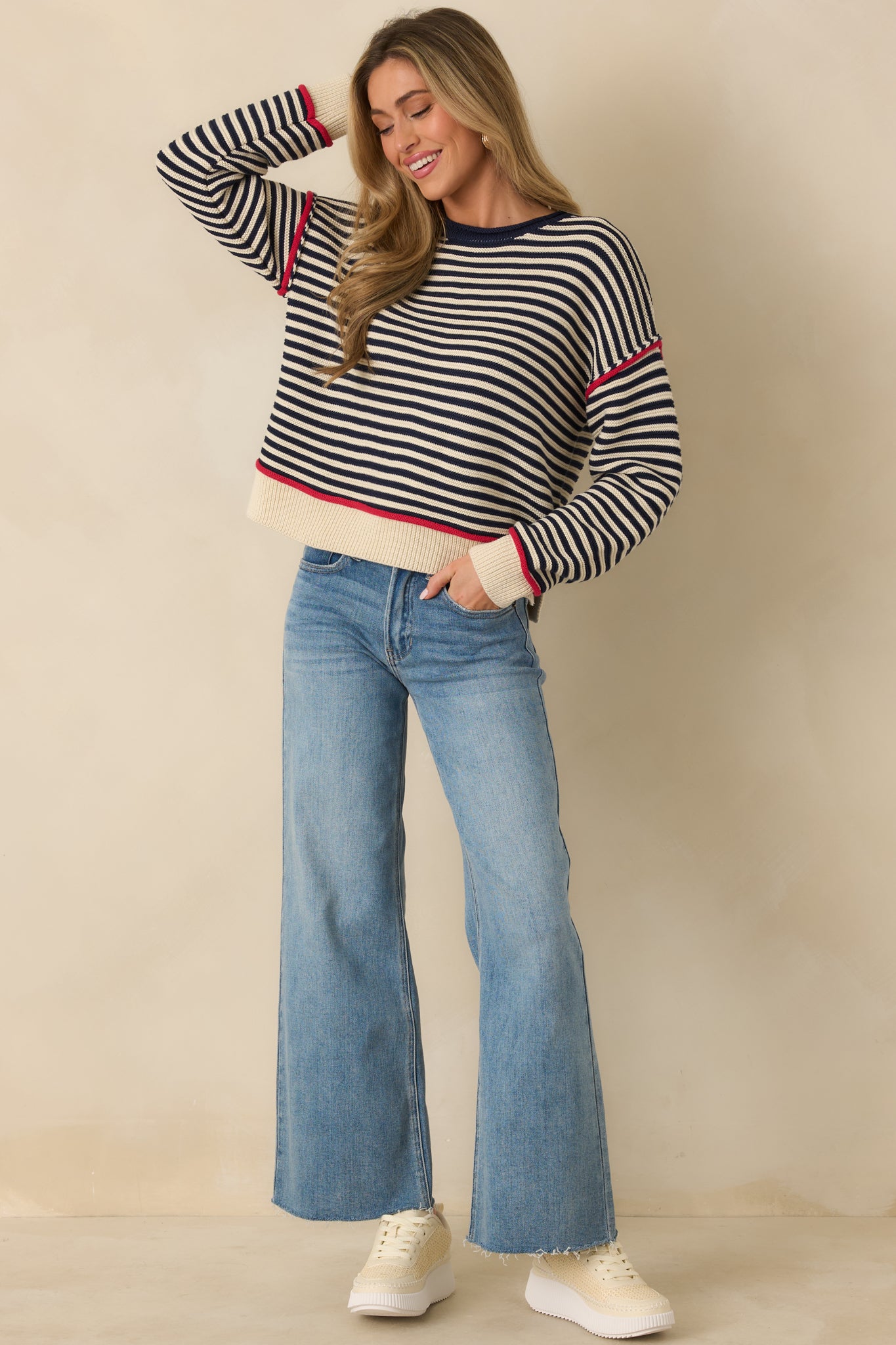 Relaxed-fit navy crewneck sweater highlighting contrast trim accents and clean ribbed edges.